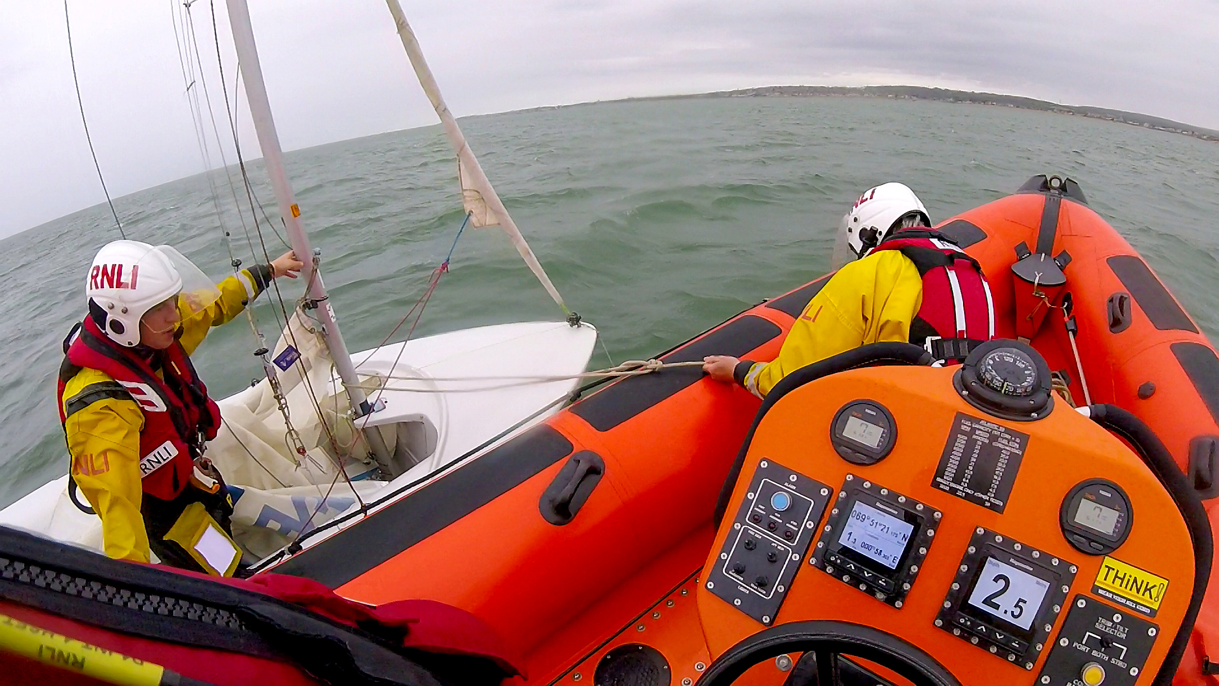 Whitstable lifeboat alongside the capsized dinghy off Seasalter on Thursday.
