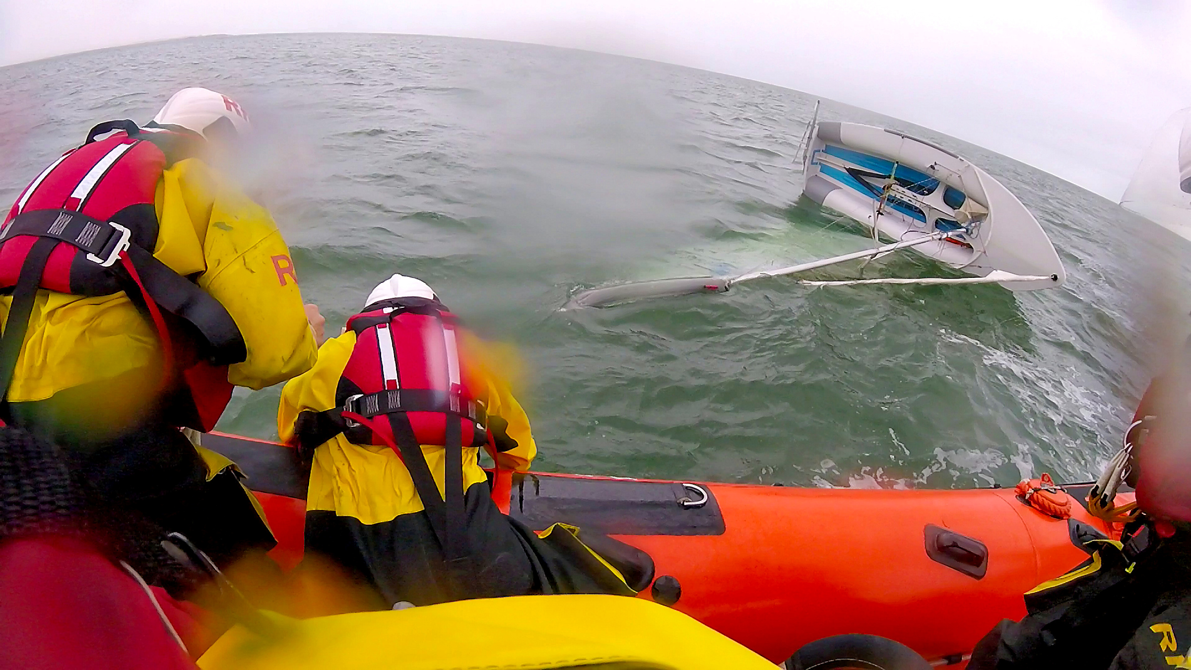Whitstable lifeboat approaches the capsized dinghy off Seasalter on Thursday.
