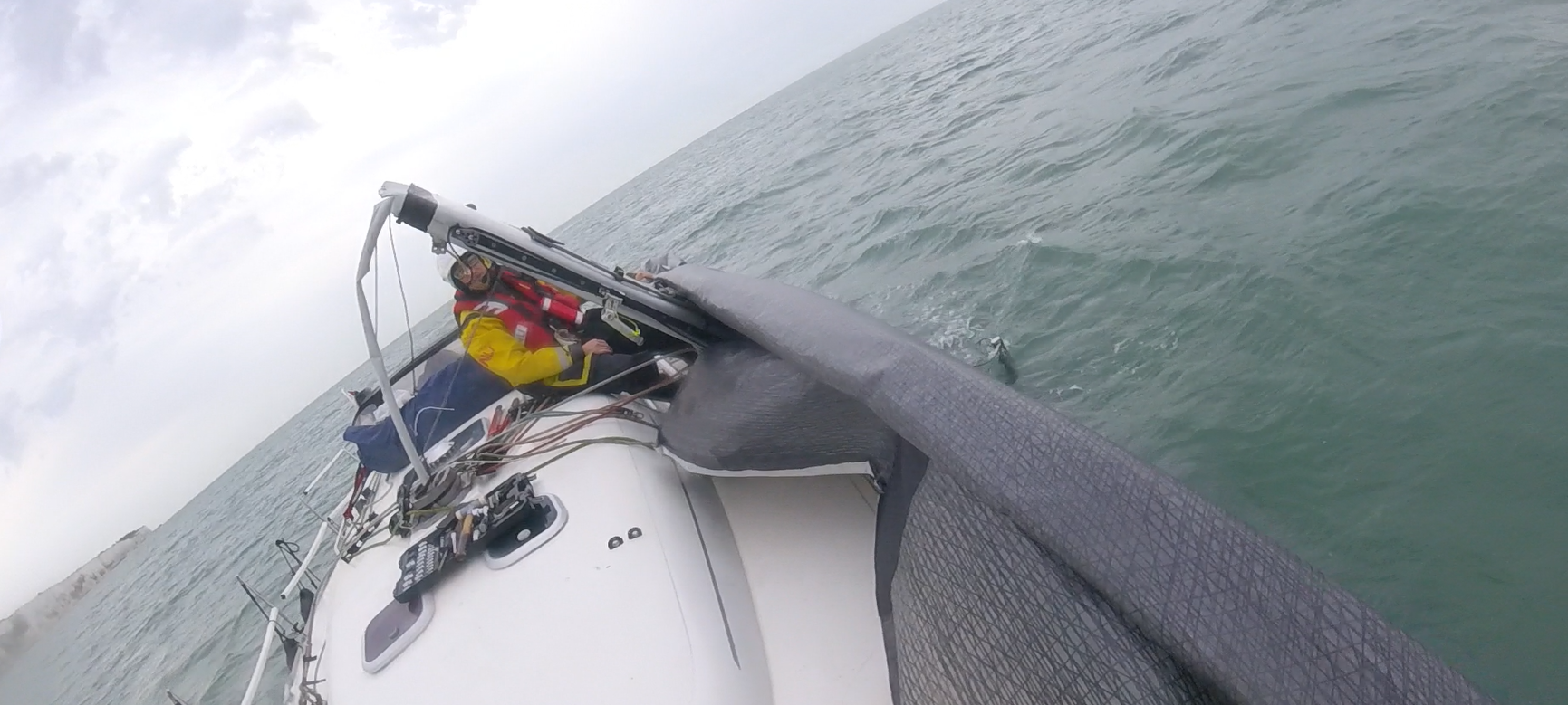 Walmer crew attempting to roll sail.