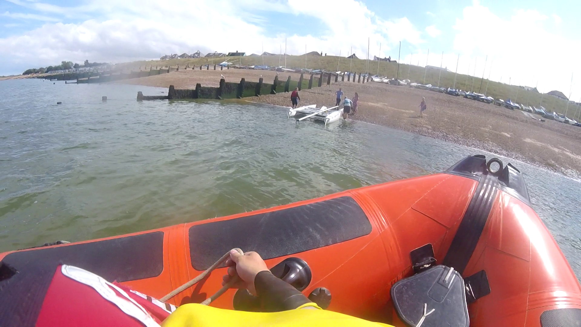 The dismasted catamaran is landed ashore at the Tankerton Bay Sailing Club on Friday afternoon.