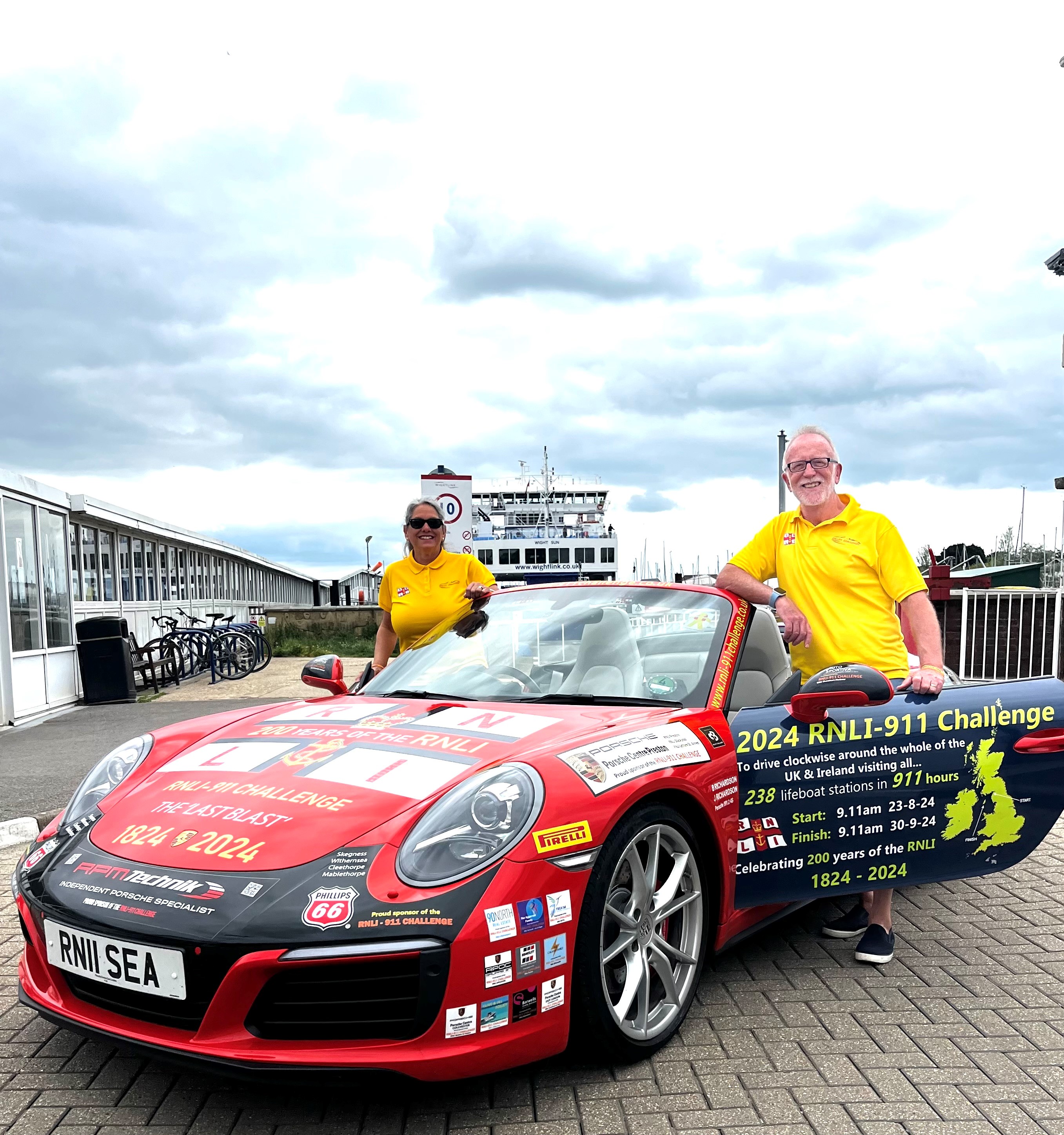 Belinda and James Richardson with their orange Porsche 911