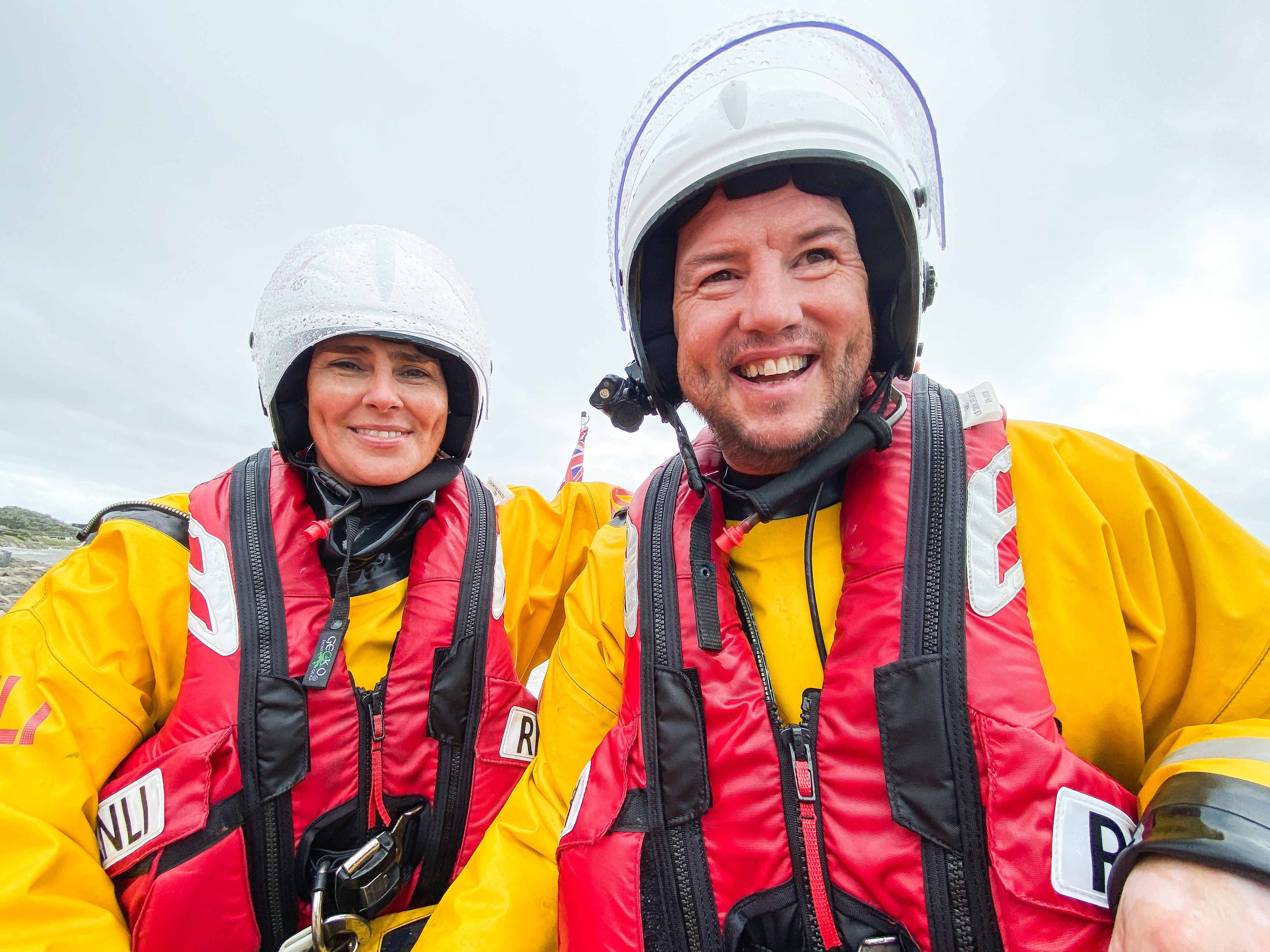 Husband and wife Lindsay and Chris Gatenby are pictured in full kit sat on the lifeboat after it had returned to shore