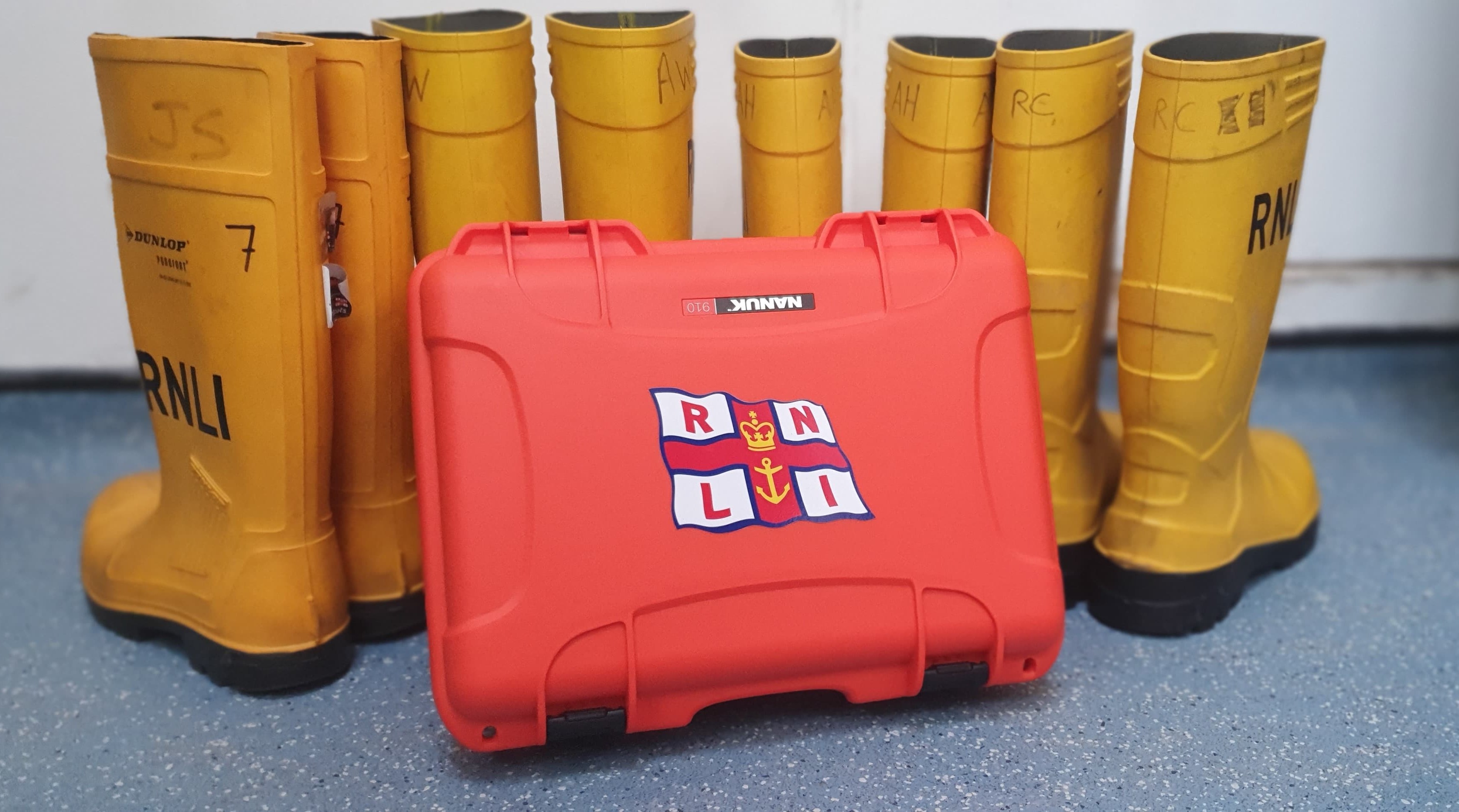 RNLI time capsule in front of RNLI wellies