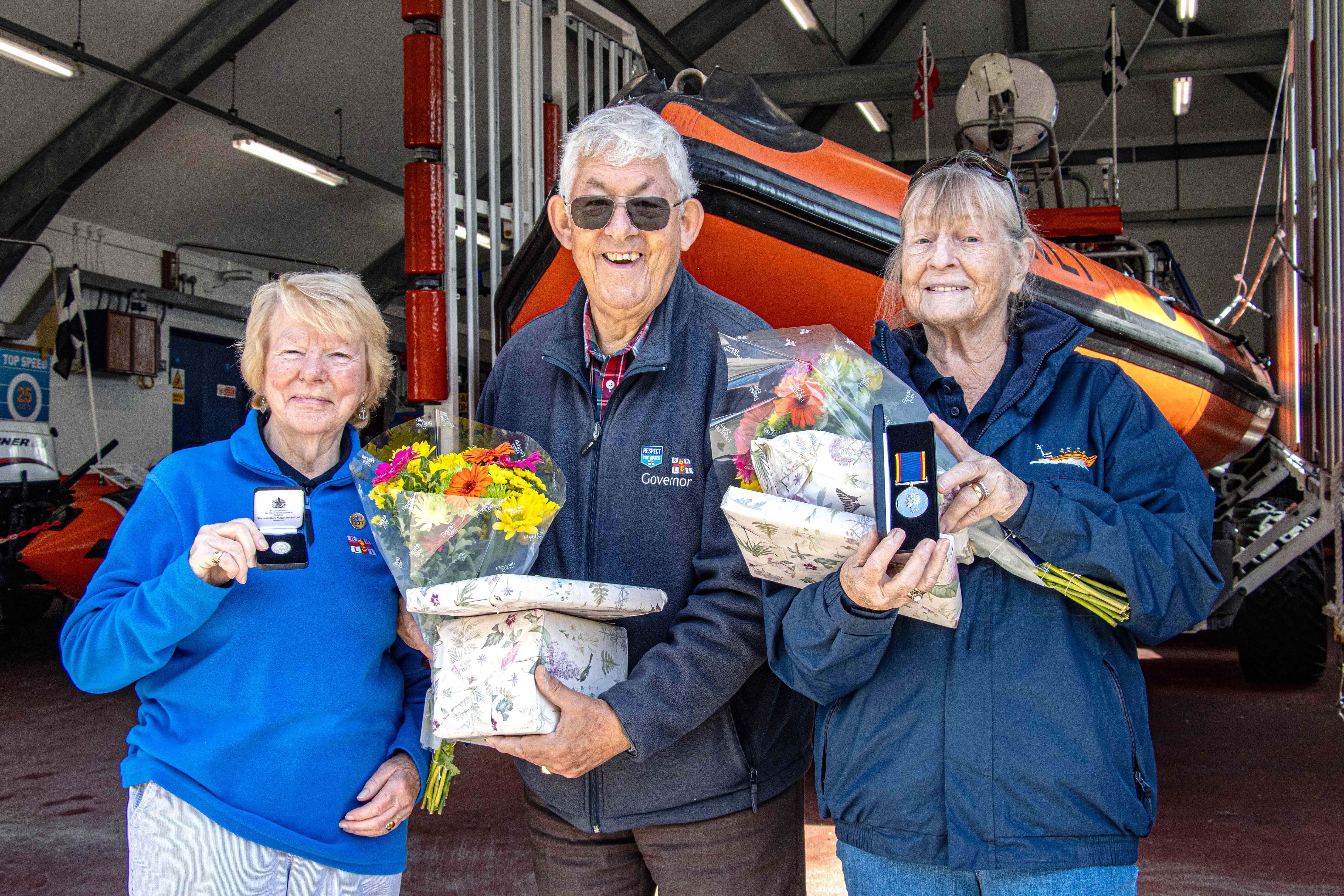 John Trethewey presenting RNLI long service awards to Marilyn Berry (L) and Ann Watson (R)