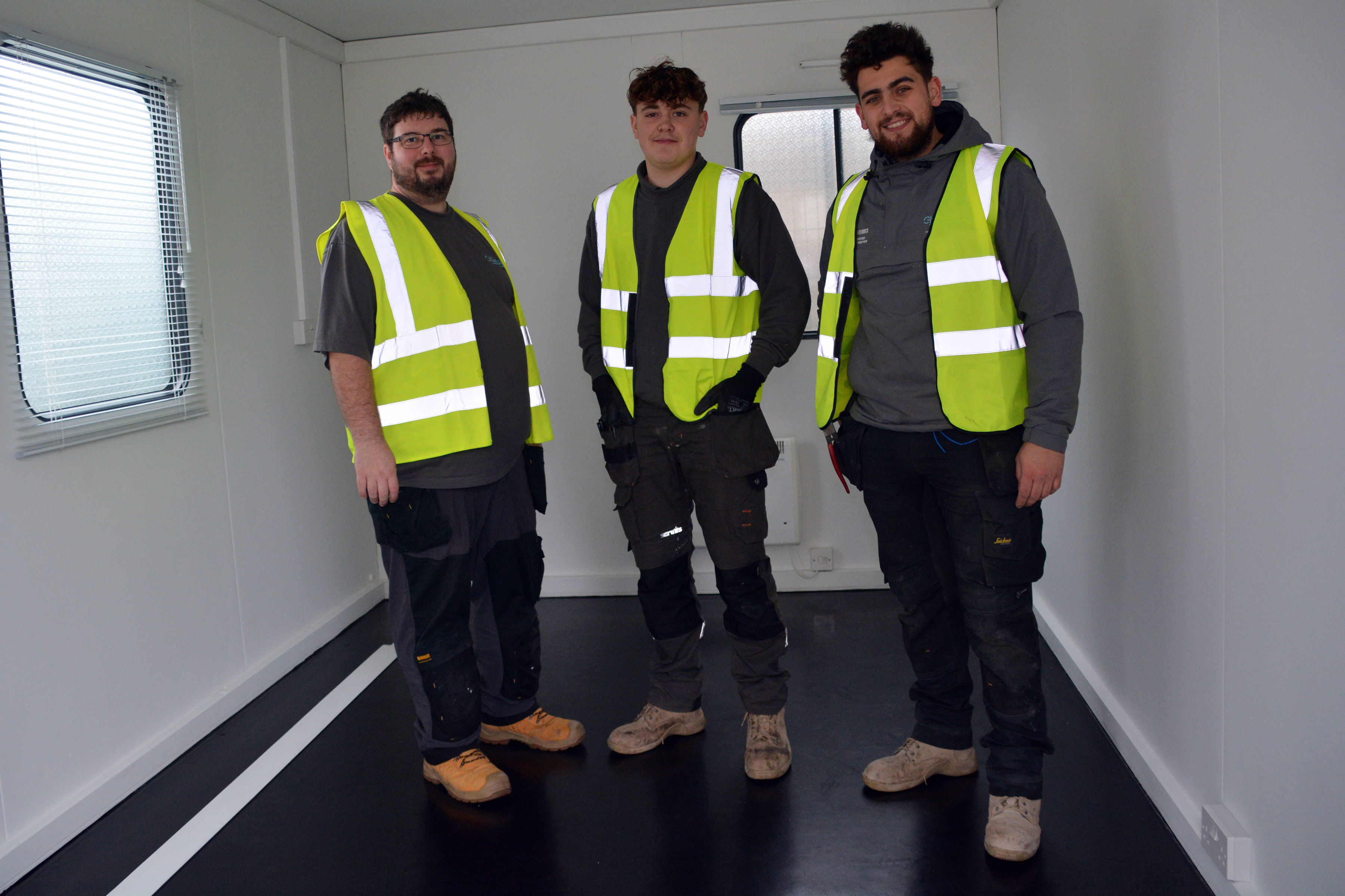 Gigawatt Electrical Services electricians Adam Bradbury-Smith, Reece Hall and Grayson Bennett. inside one of the two portable buildings