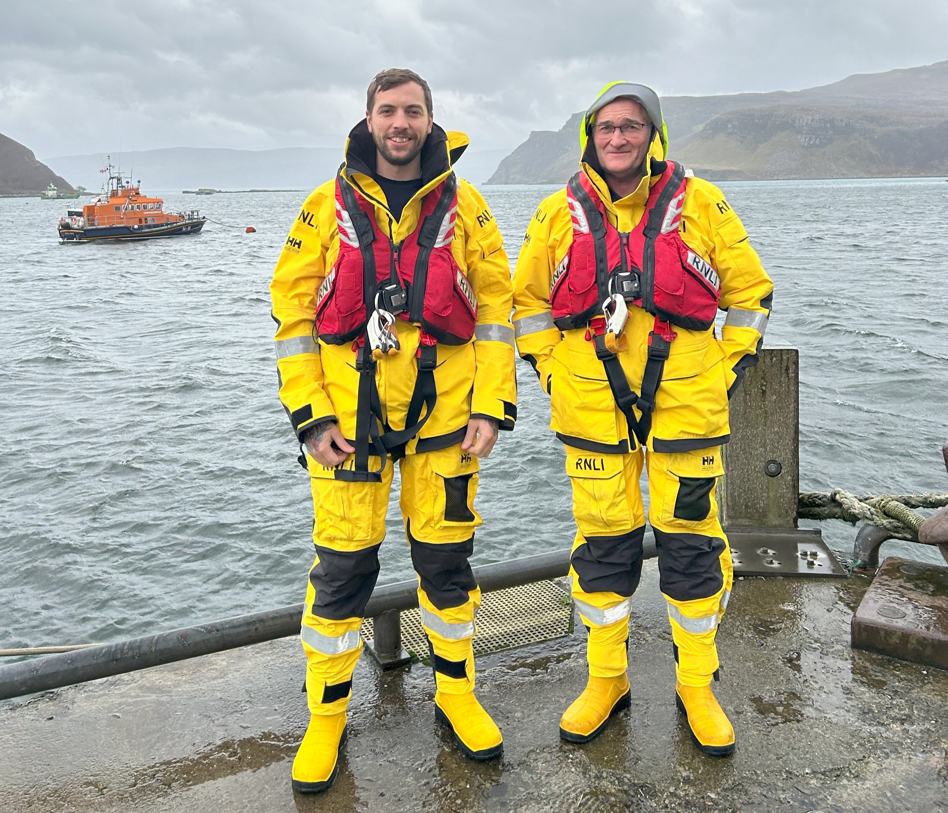 A picture of new mechanic Josh Masson with full time station mechanic John "Clanky" Nicolson and lifeboat Stanley Watson Barker in the background.