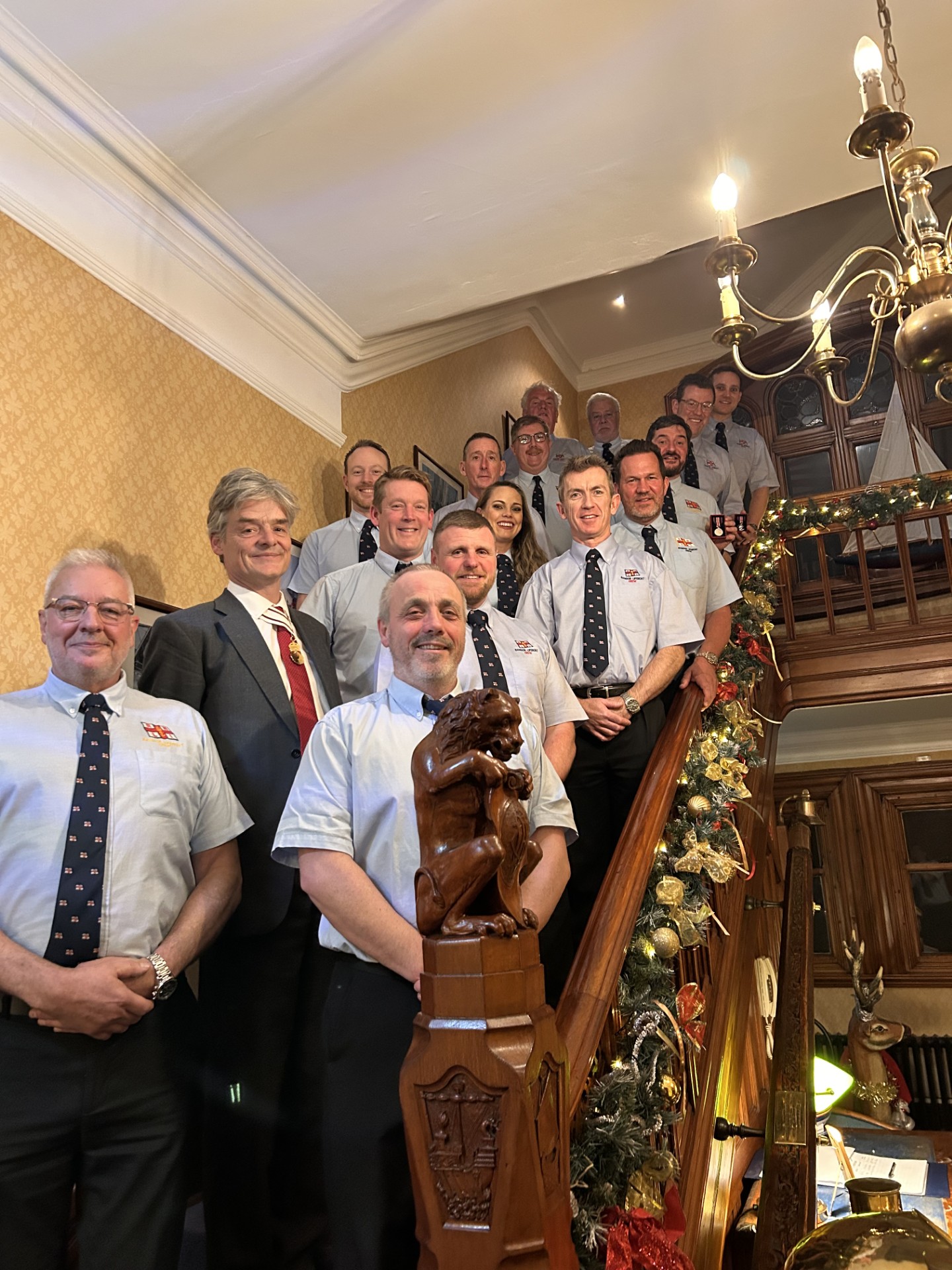 Lord Lieutenant of County Down and Bangor Crew on the staircase of Royal Ulster Yacht Club