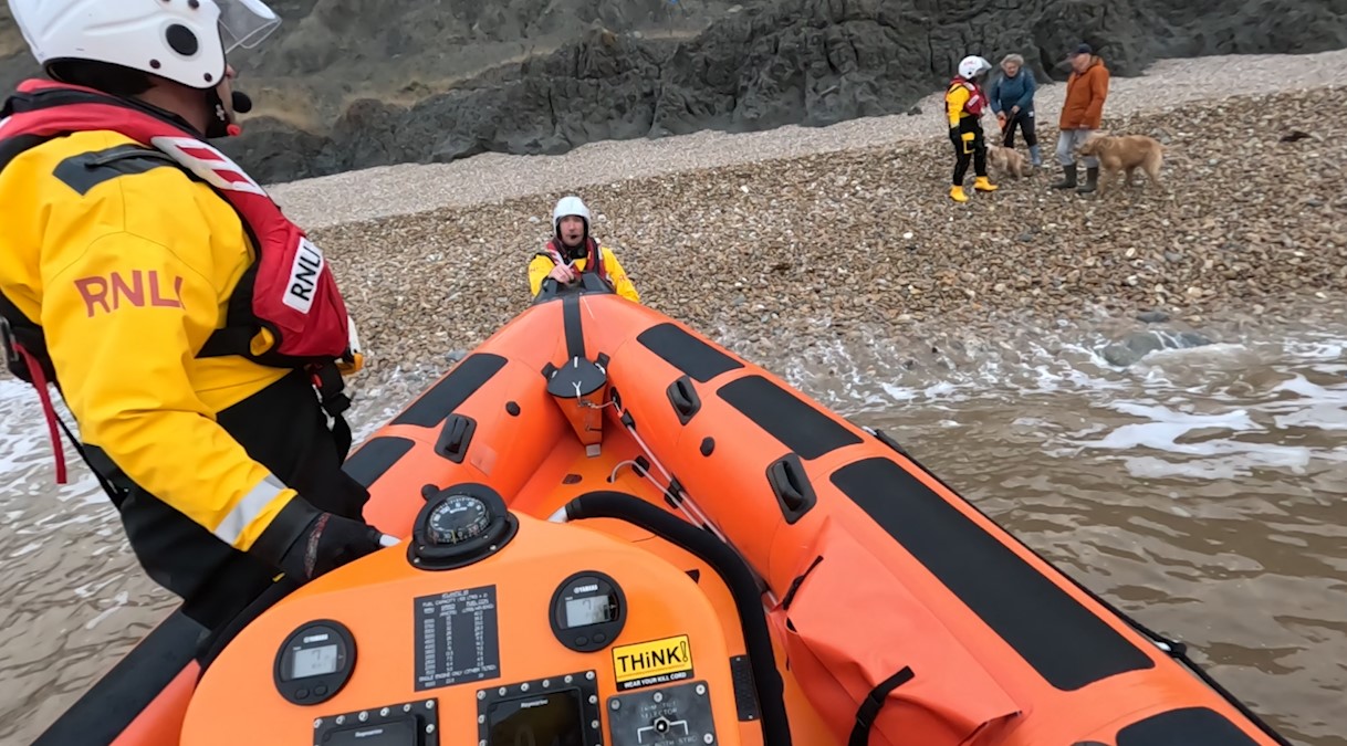 Lyme Regis RNLI volunteers rescue two people and their dogs cut off by ...