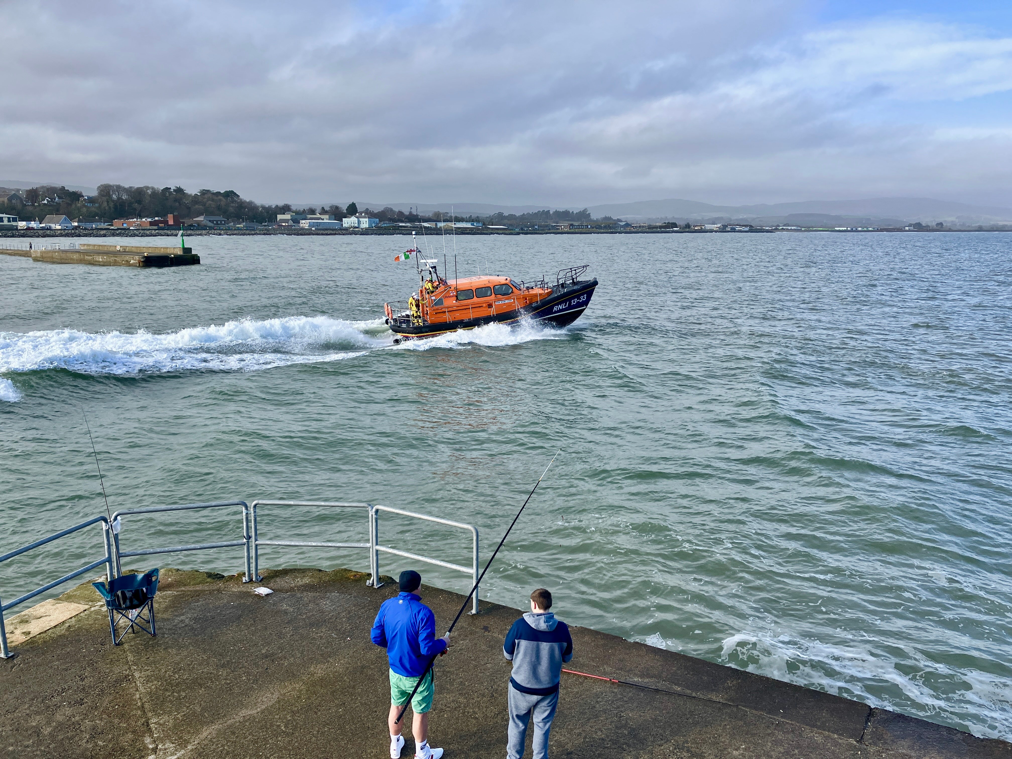 Wicklow lifeboat leaves the harbour to assist the fishermen.