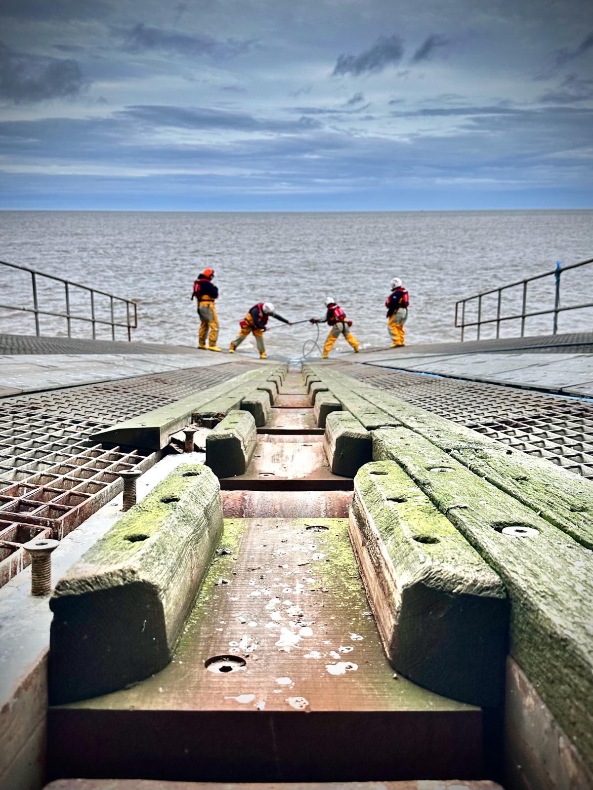 photo of shore crew on the slipway preparing for the recovery of the lifeboat