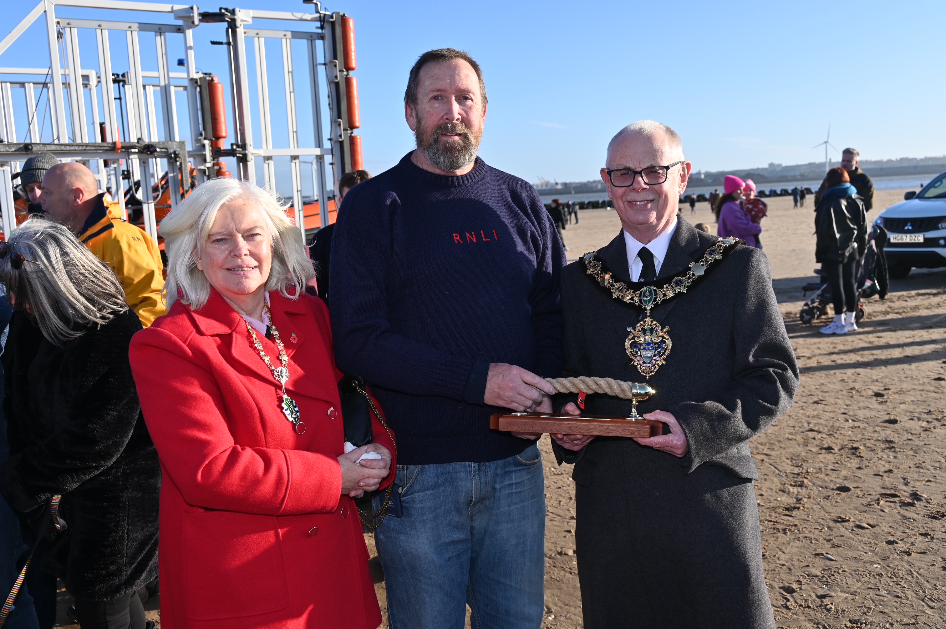Mike Jones, senior helm for New Brighton RNLI, poses with the Lord Mayor and Mayor's wife with the Bob Grant Memorial Trophy.