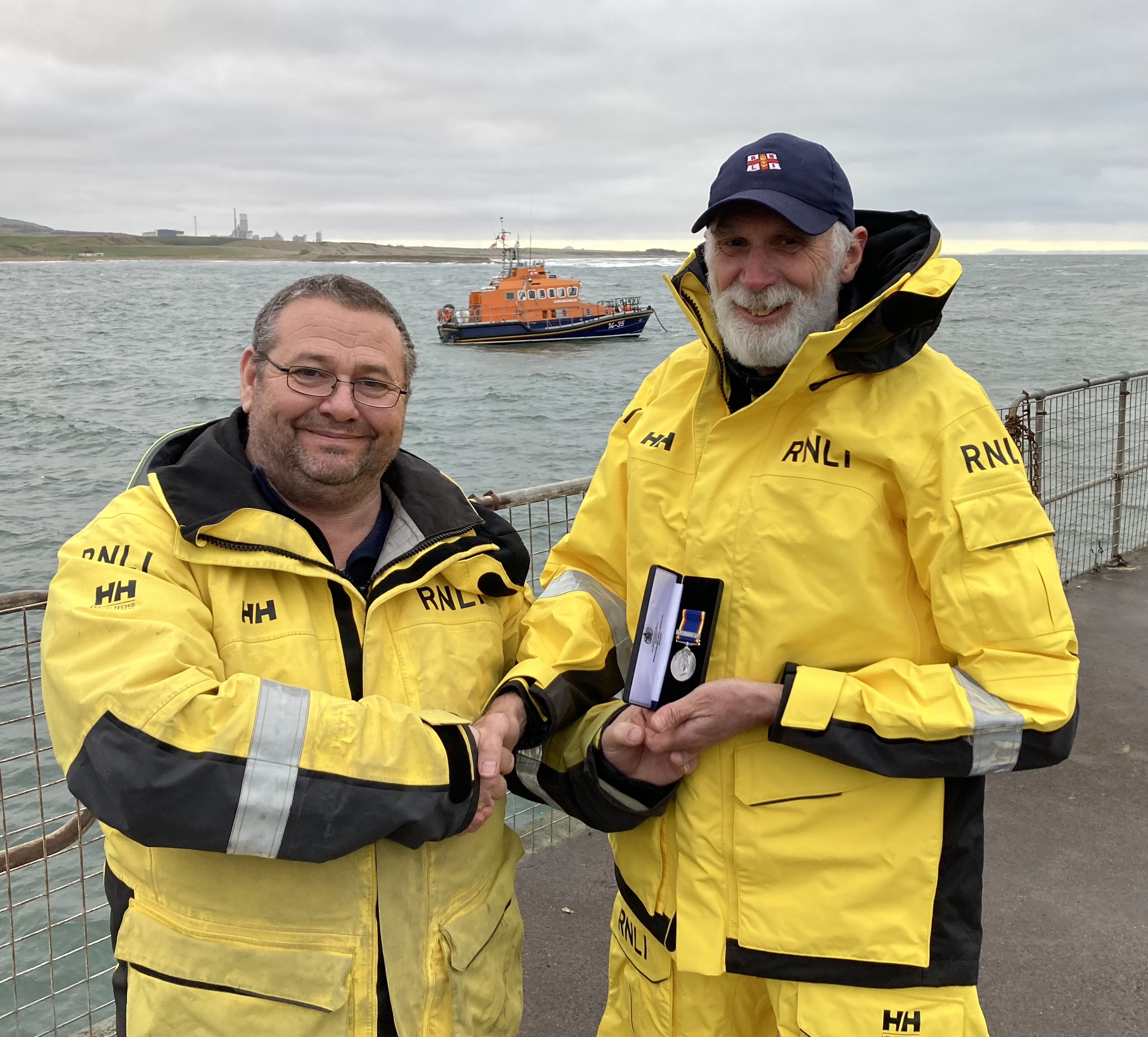 Dunbar coxswain Gary Fairbairn with Alistair Punton with the lifeboat in the background.