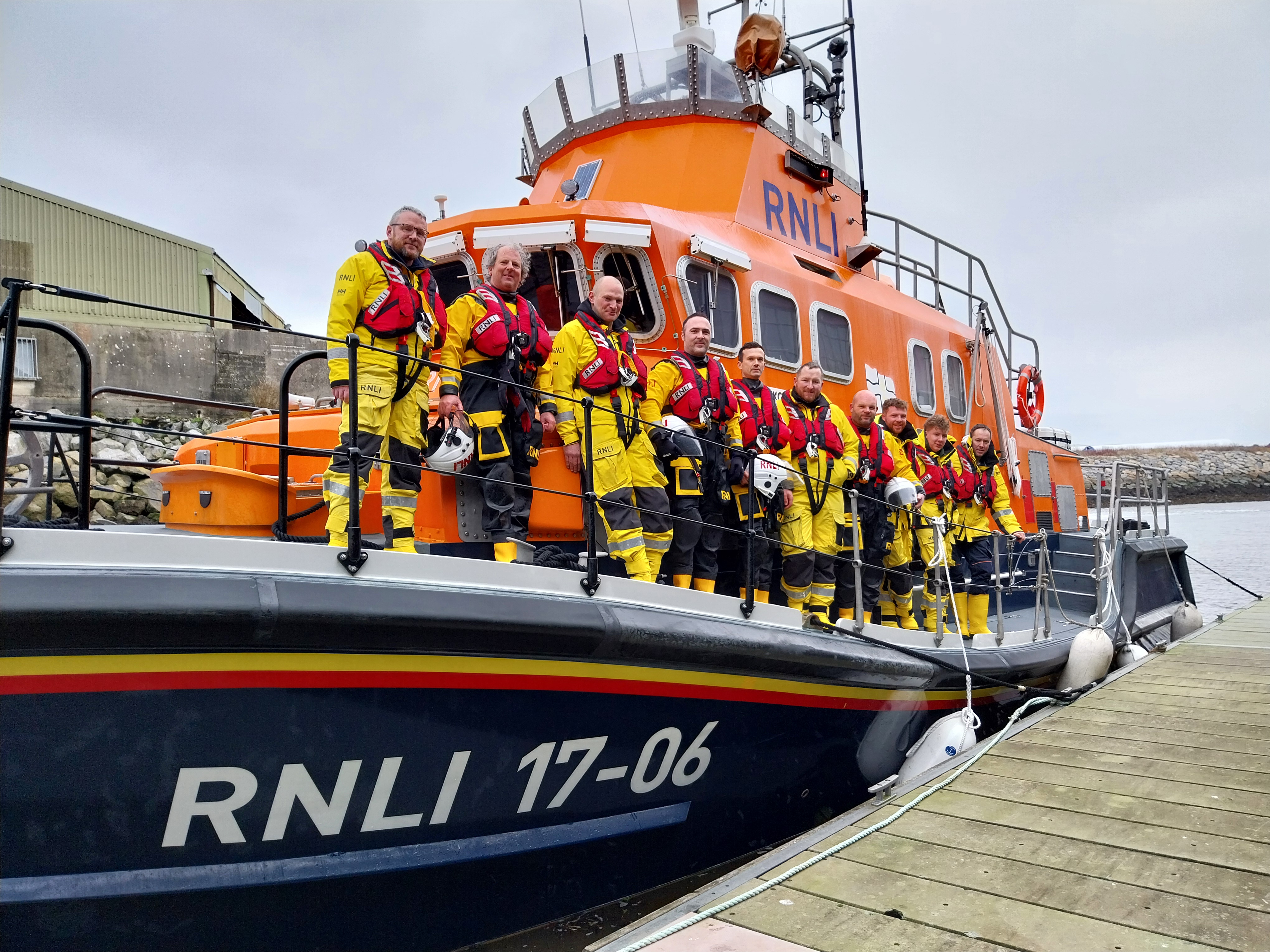 Six crew from Aran Islands ALB with four crew from Galway ILB on the deck of the ALB David Kirkaldy which is tied up at the pontoon at Galway Lifeboat Station
