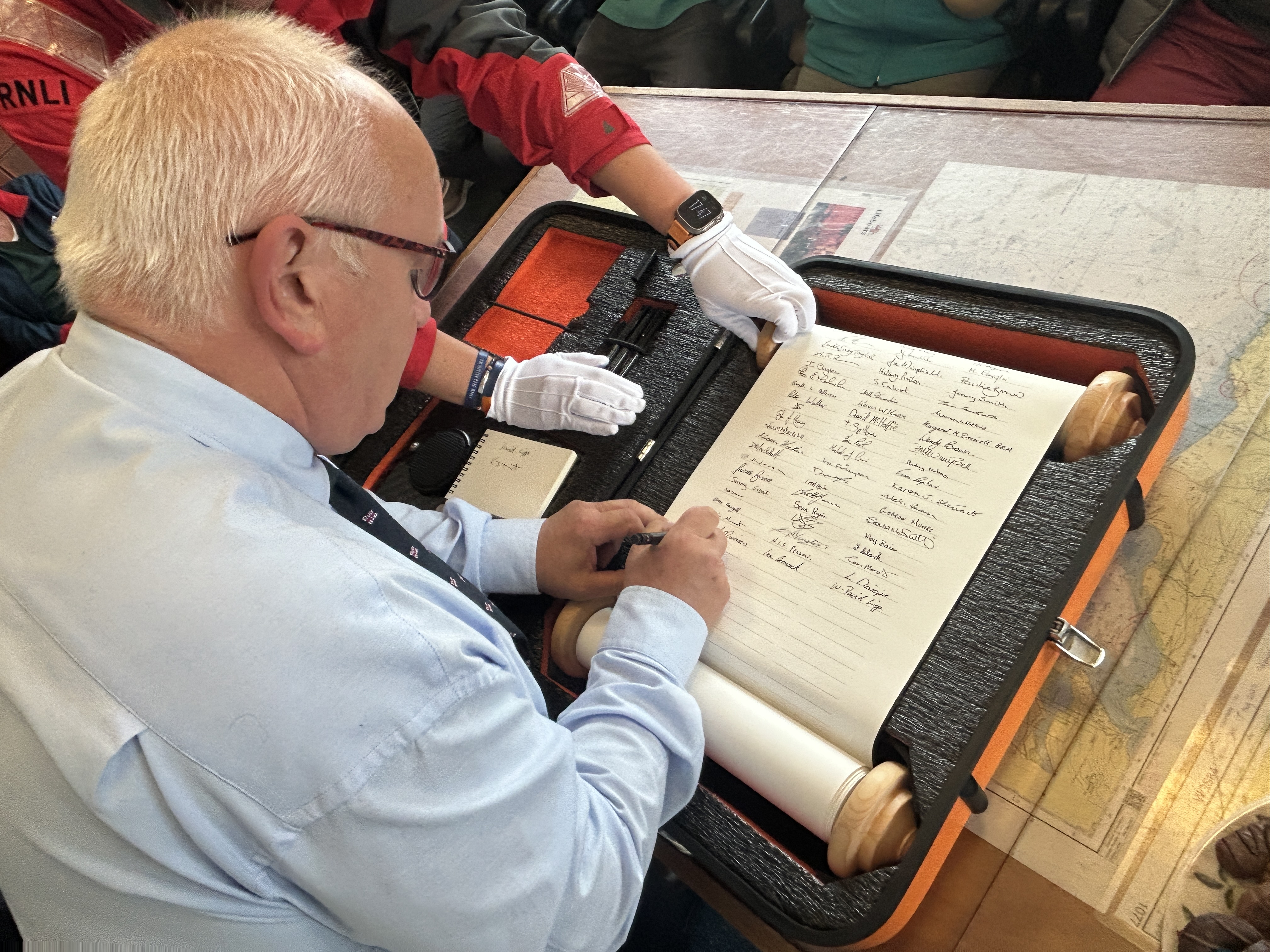 Kevin Dent signing RNLI 200 Scroll