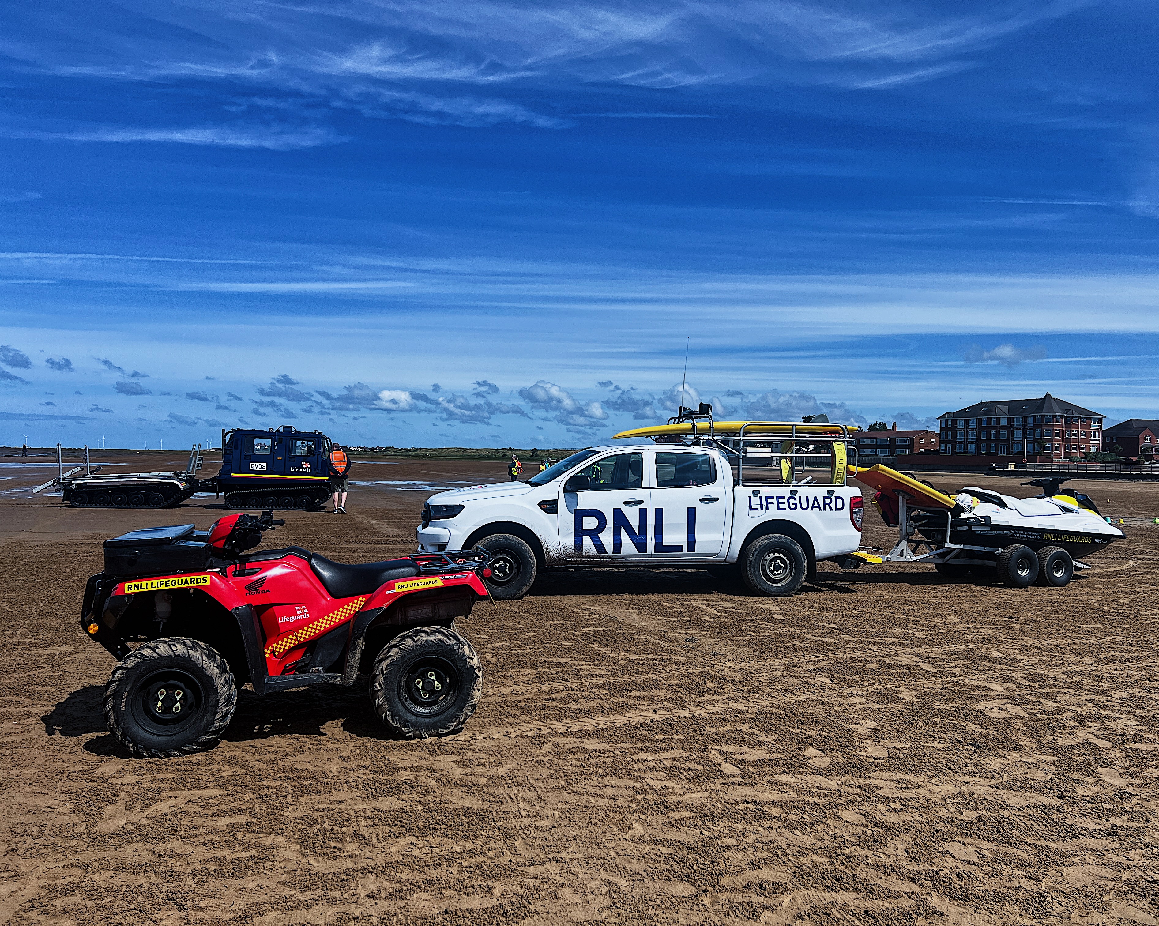 West Kirby RNLI BV and Lifeguard vehicles on West Kirby beach