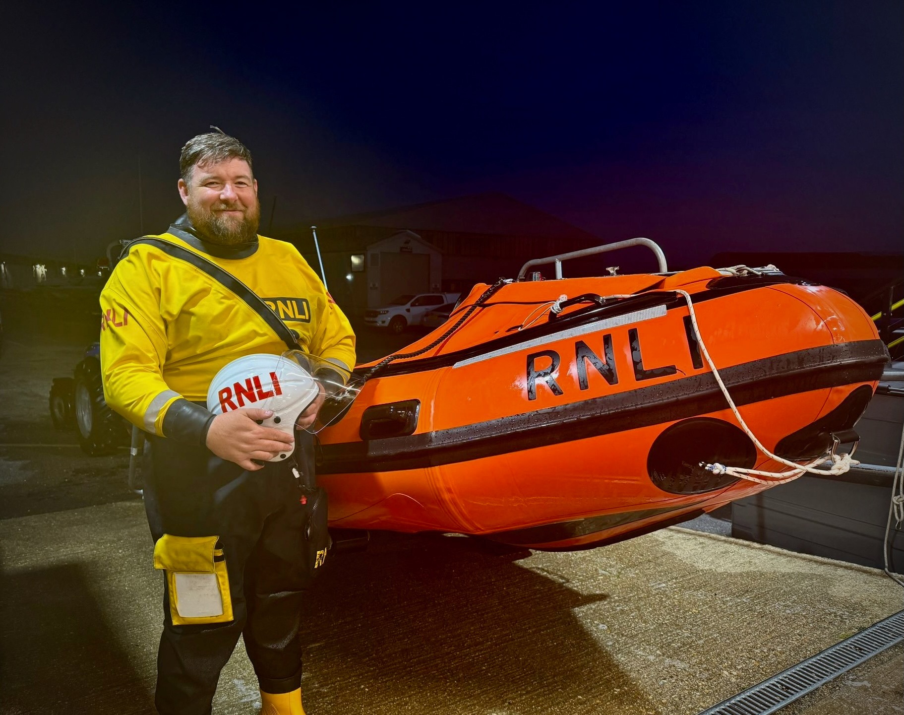 Ant Hole standing next to Calshot RNLI's D Class Lifeboat 'David Radcliffe'