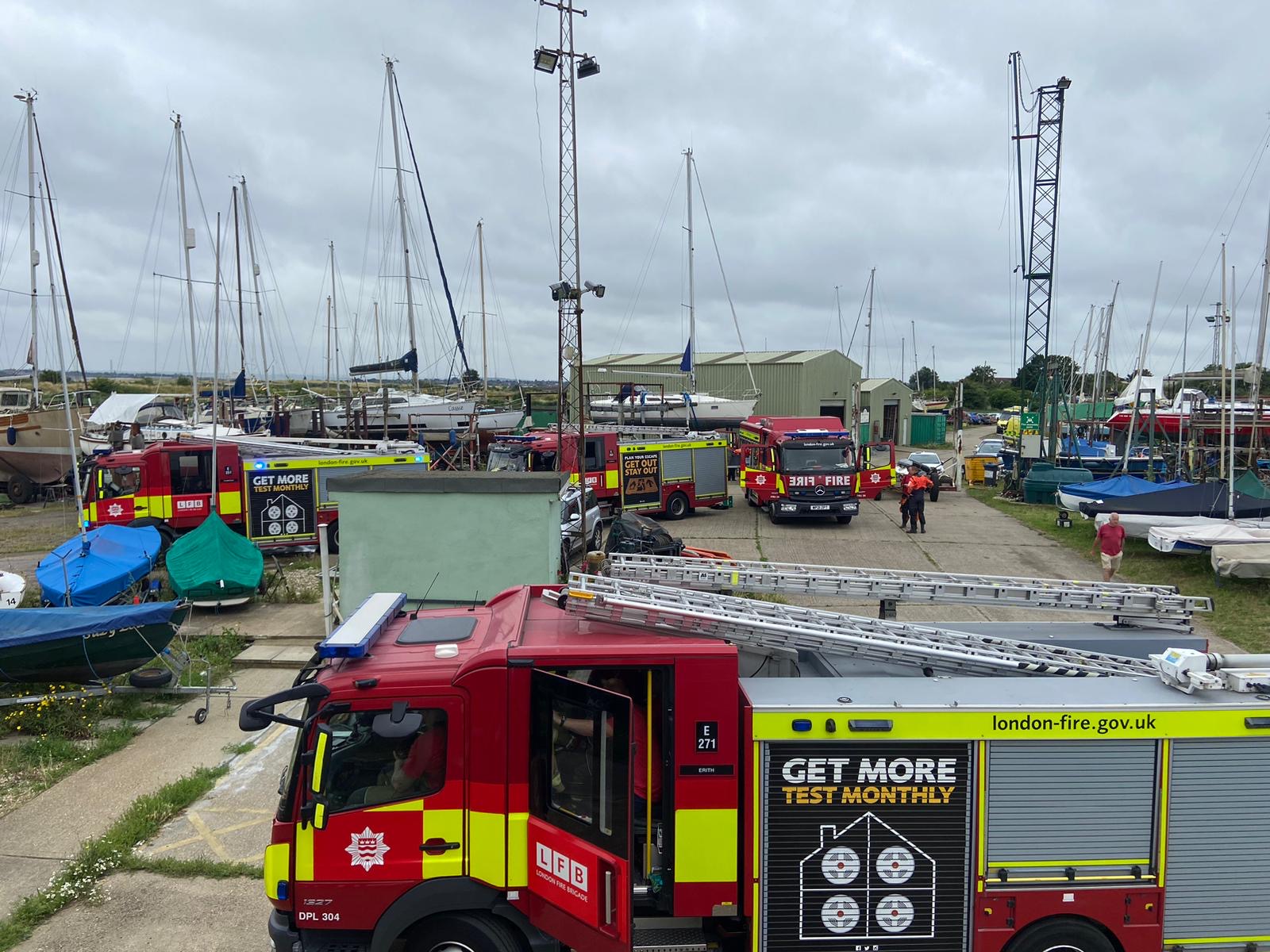 Fire trucks amongst vessels at yacht club