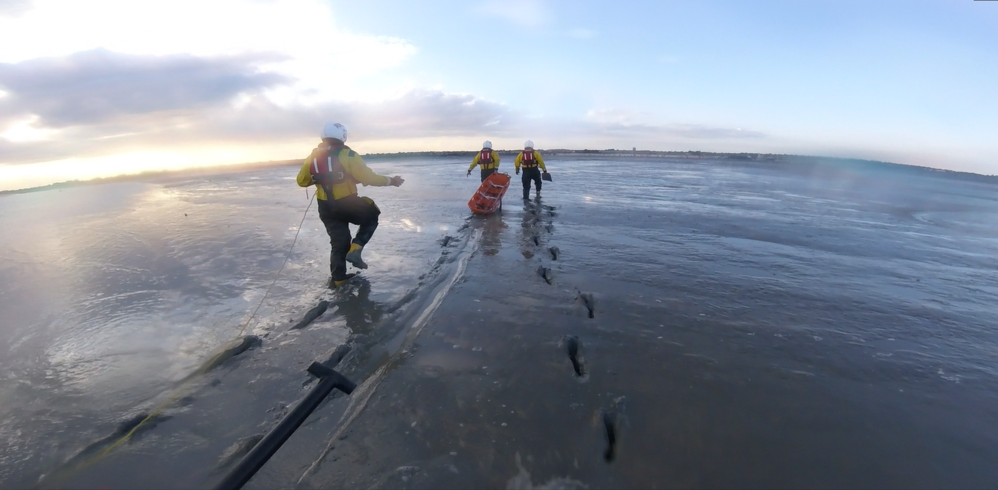Crew crossing the mud