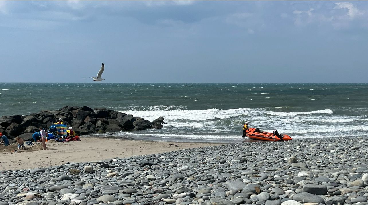 Borth Beach with Coastguard crew and beached lifeboat 