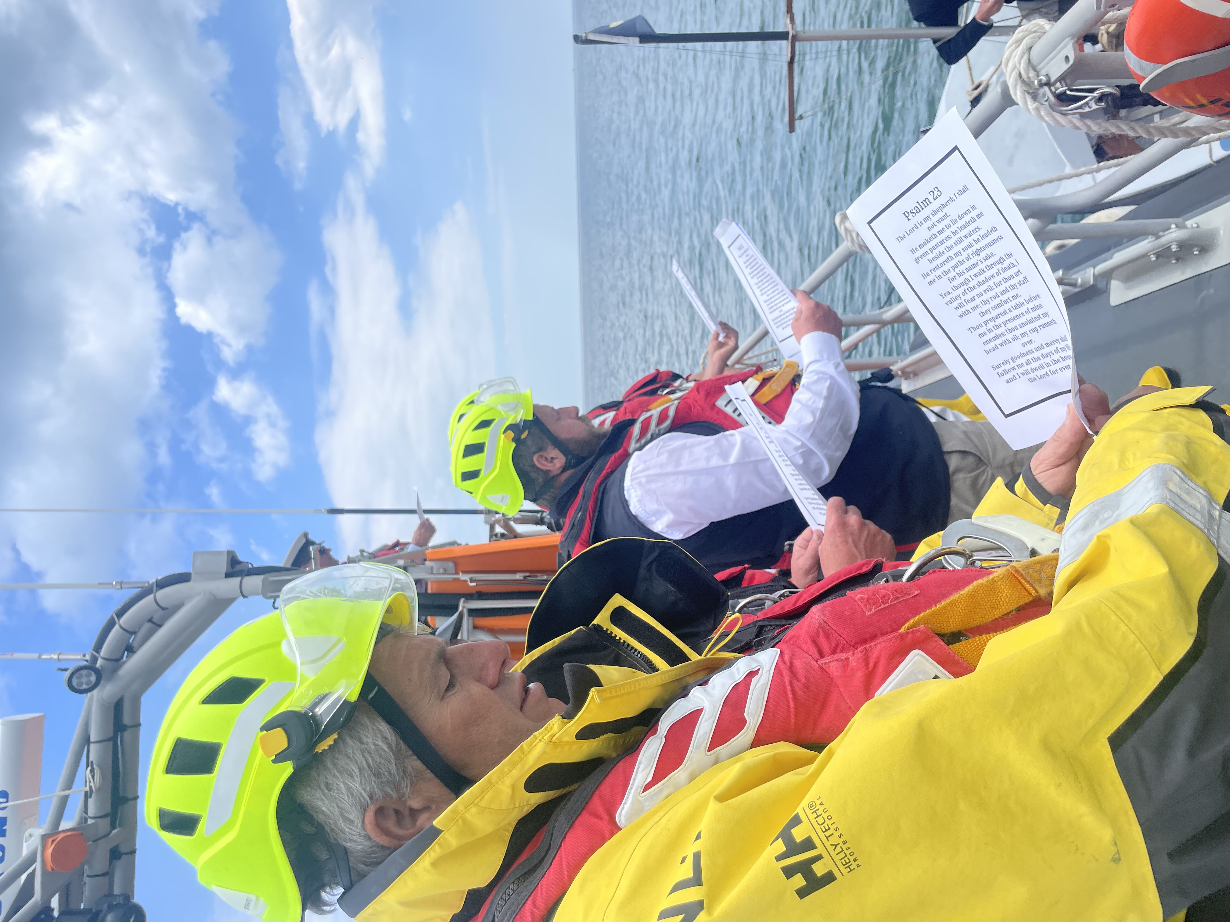 Crew reading from a sheet of paper 