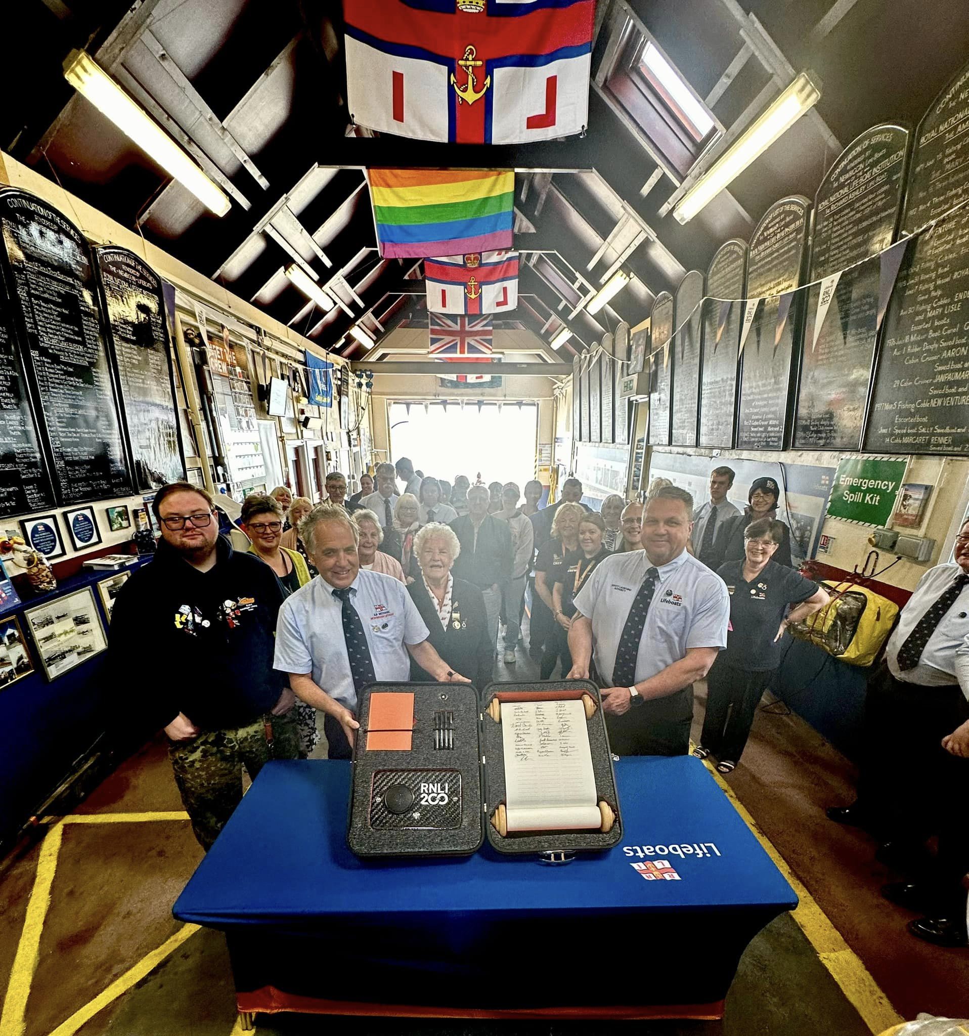Volunteers and guests at the station ceremony