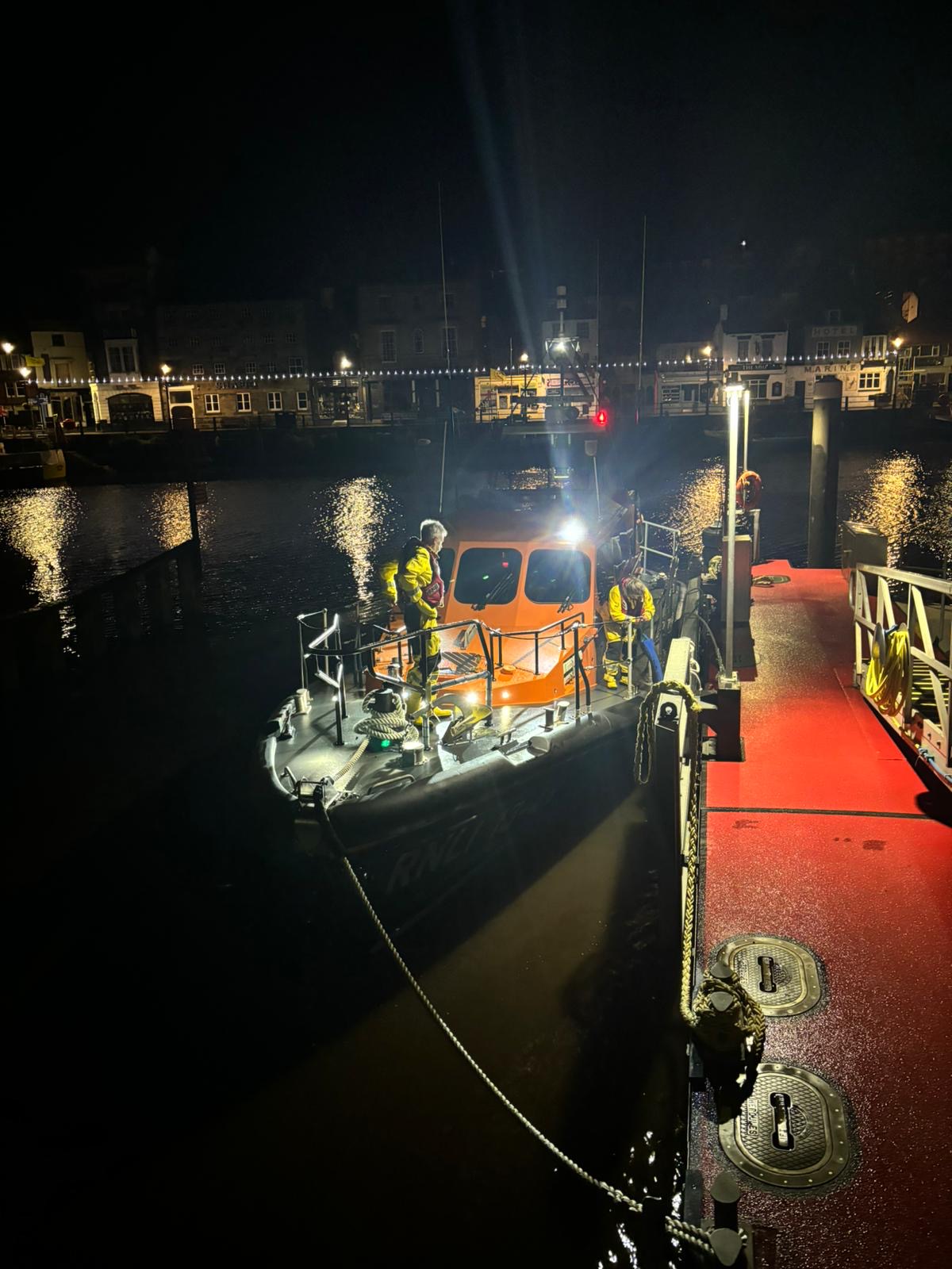 RNLI Crew on the all weather lifeboat in the dark