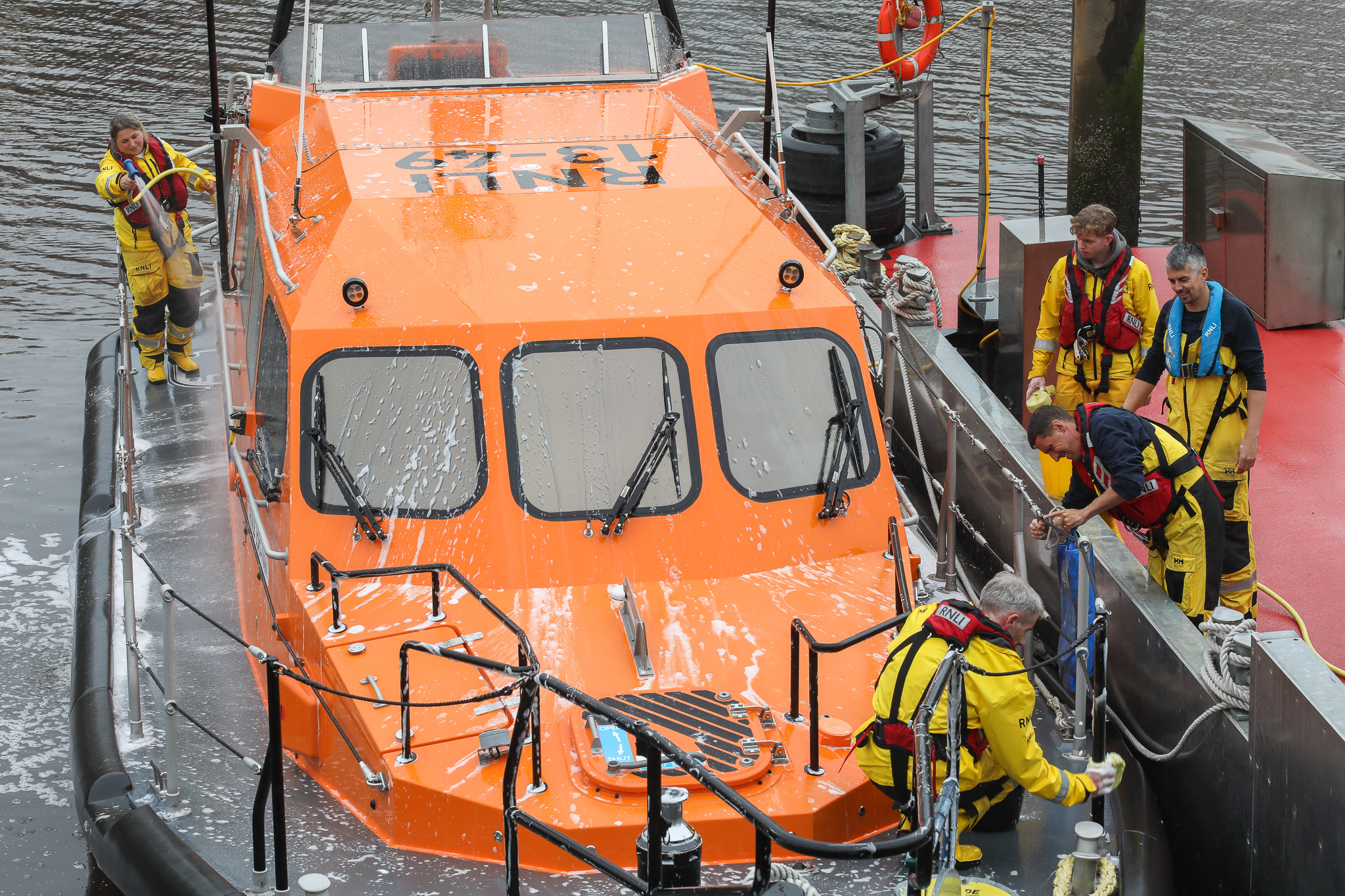 RNLI crew washing down the all-weather lifeboat