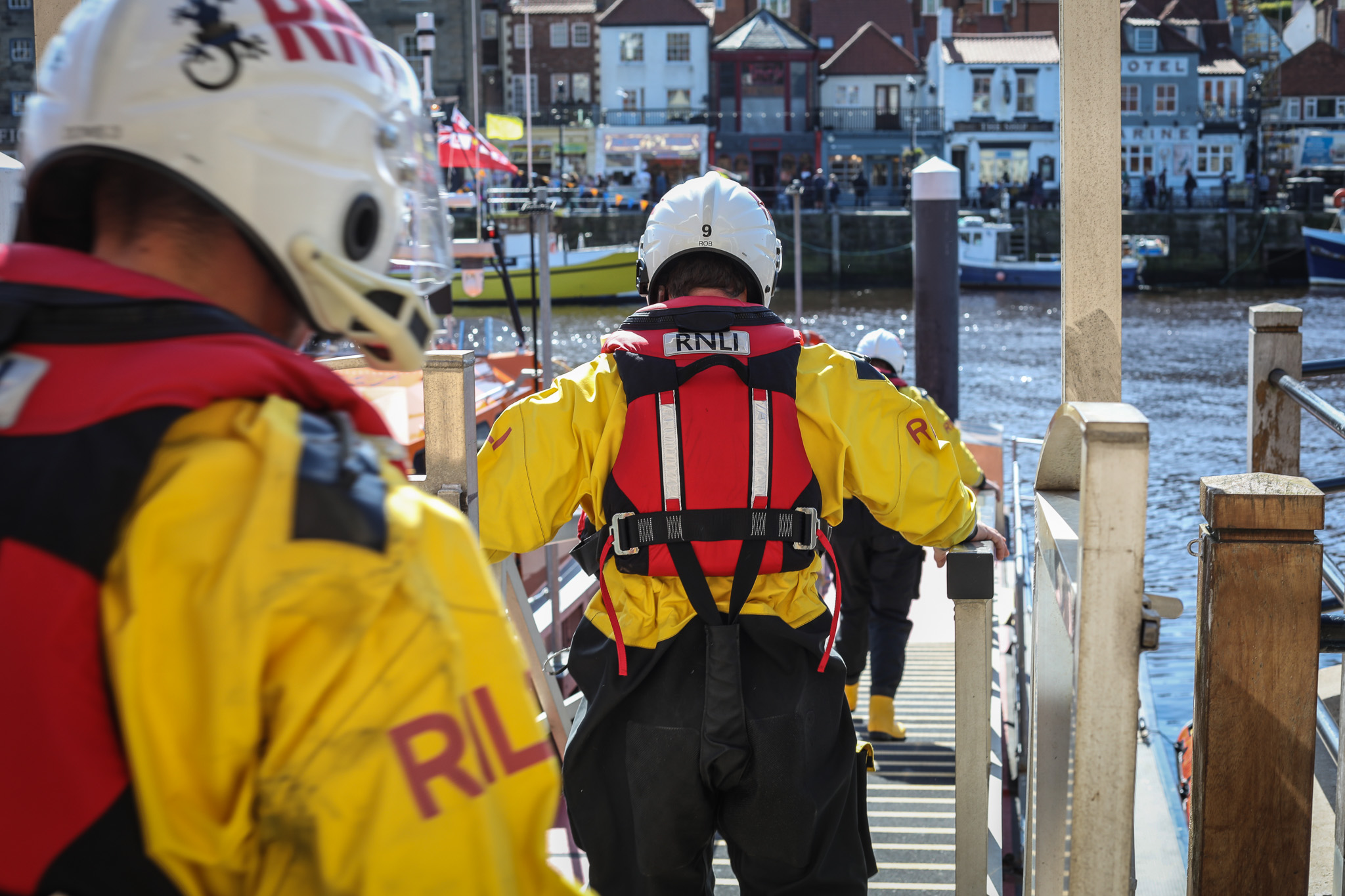 Lifeboat crew preparing to launch at the lifeboat station.