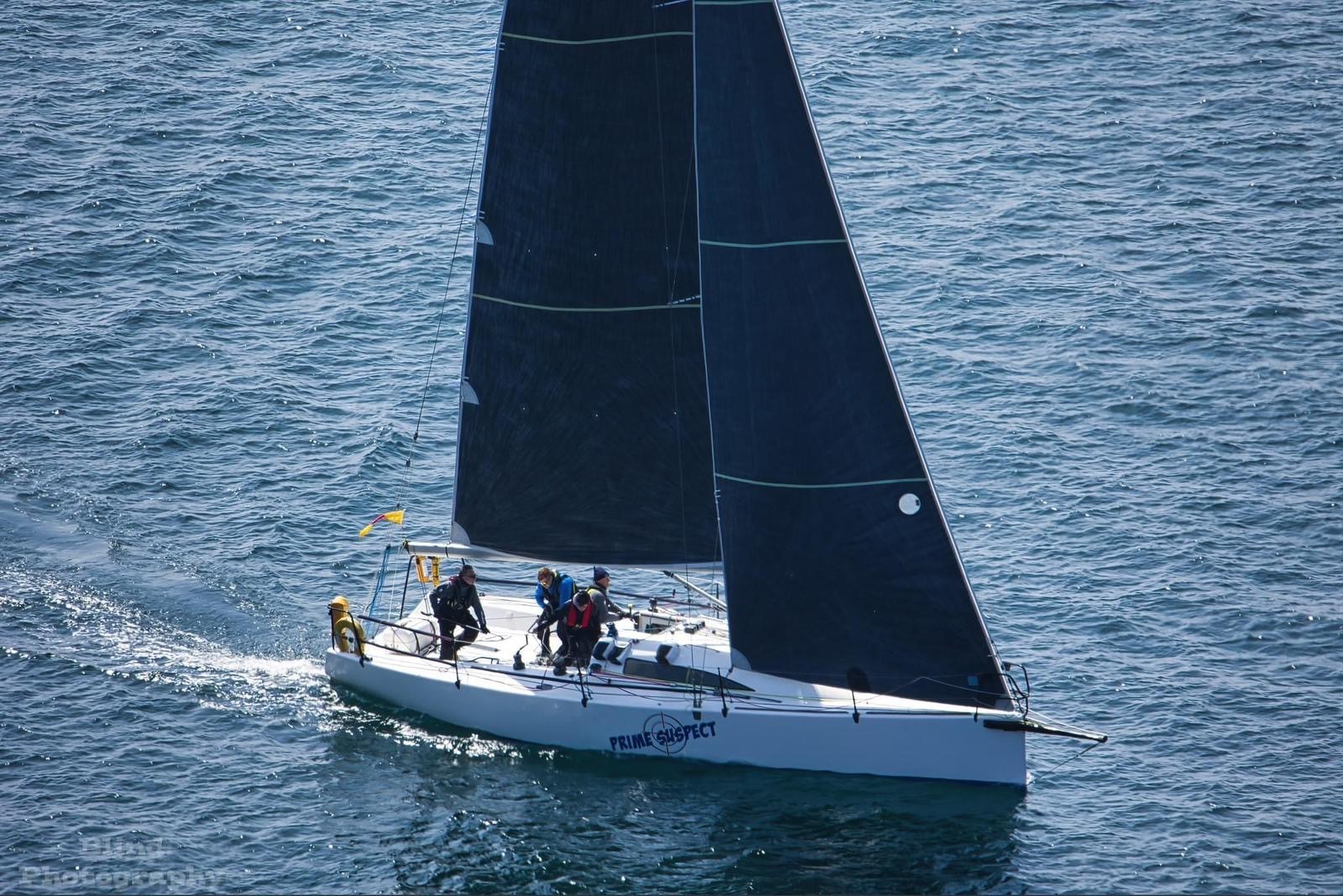 Prime Suspect flying under the RNLI burgee for Round Ireland race