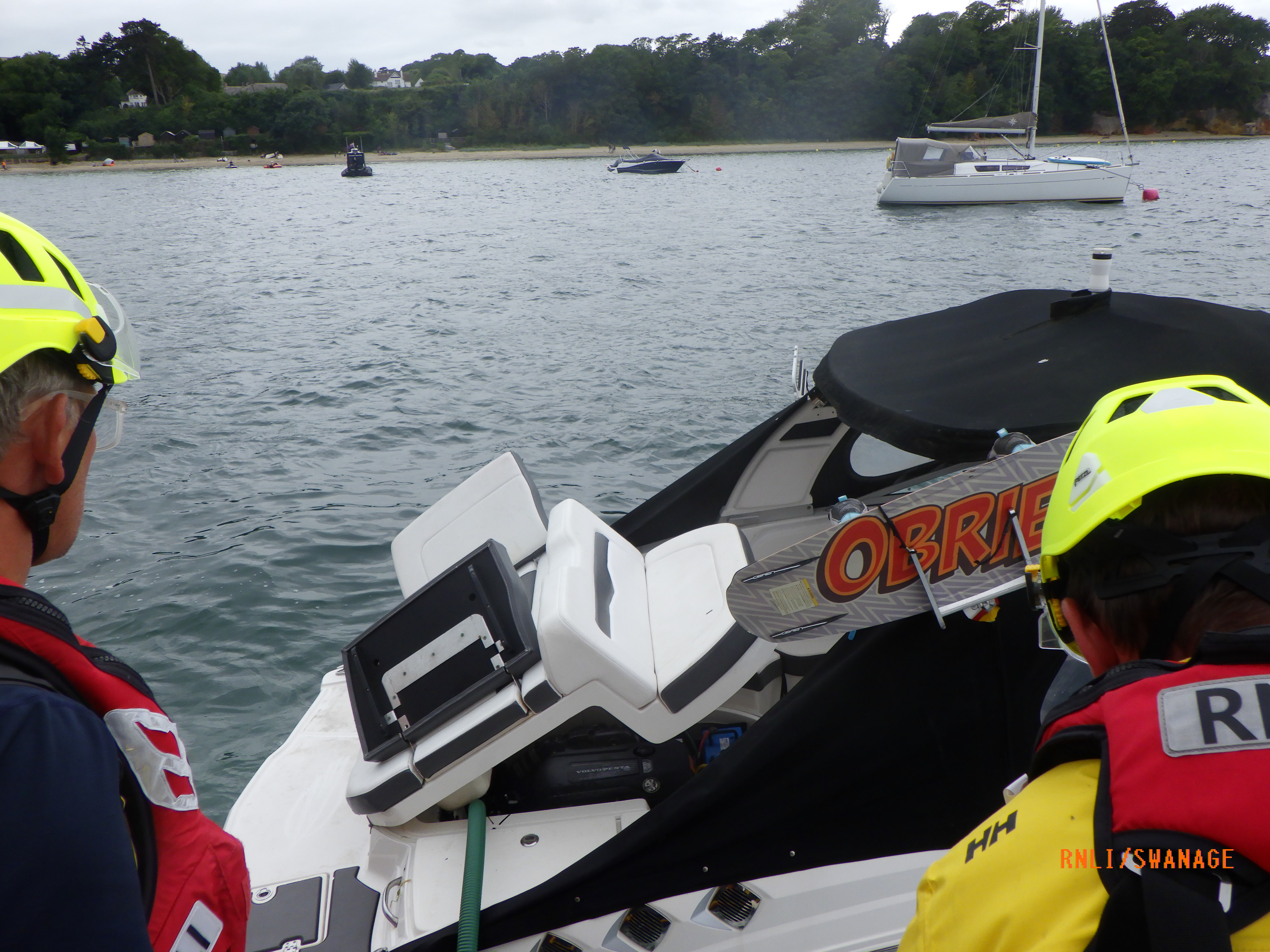 Swanage all-weather lifeboat alongside the casualty vessel with the salvage pump running to extract water from the engine space on the casualty vessel.