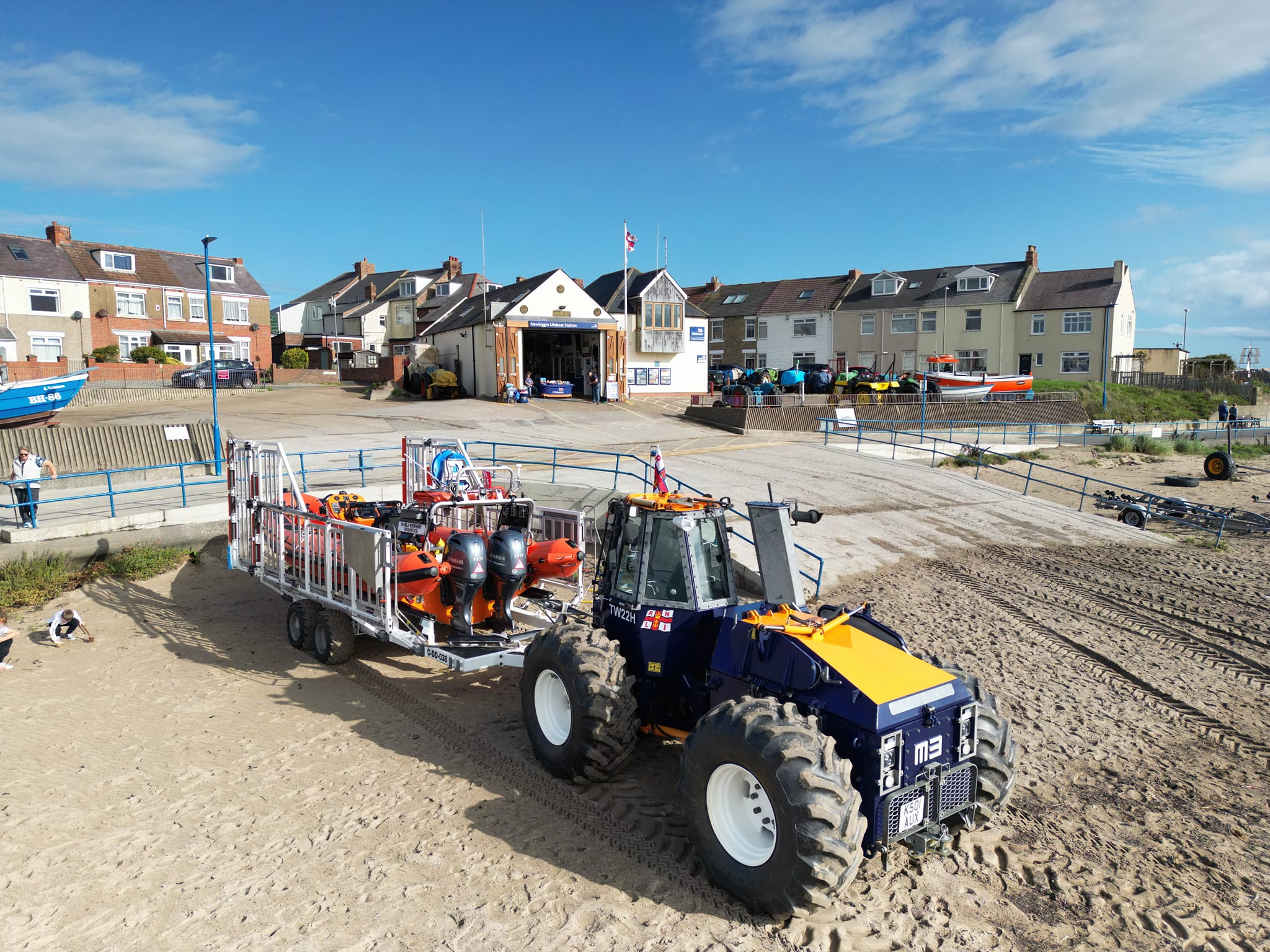The lifeboat and launching tractor on the beach down from the original 1851 boathouse