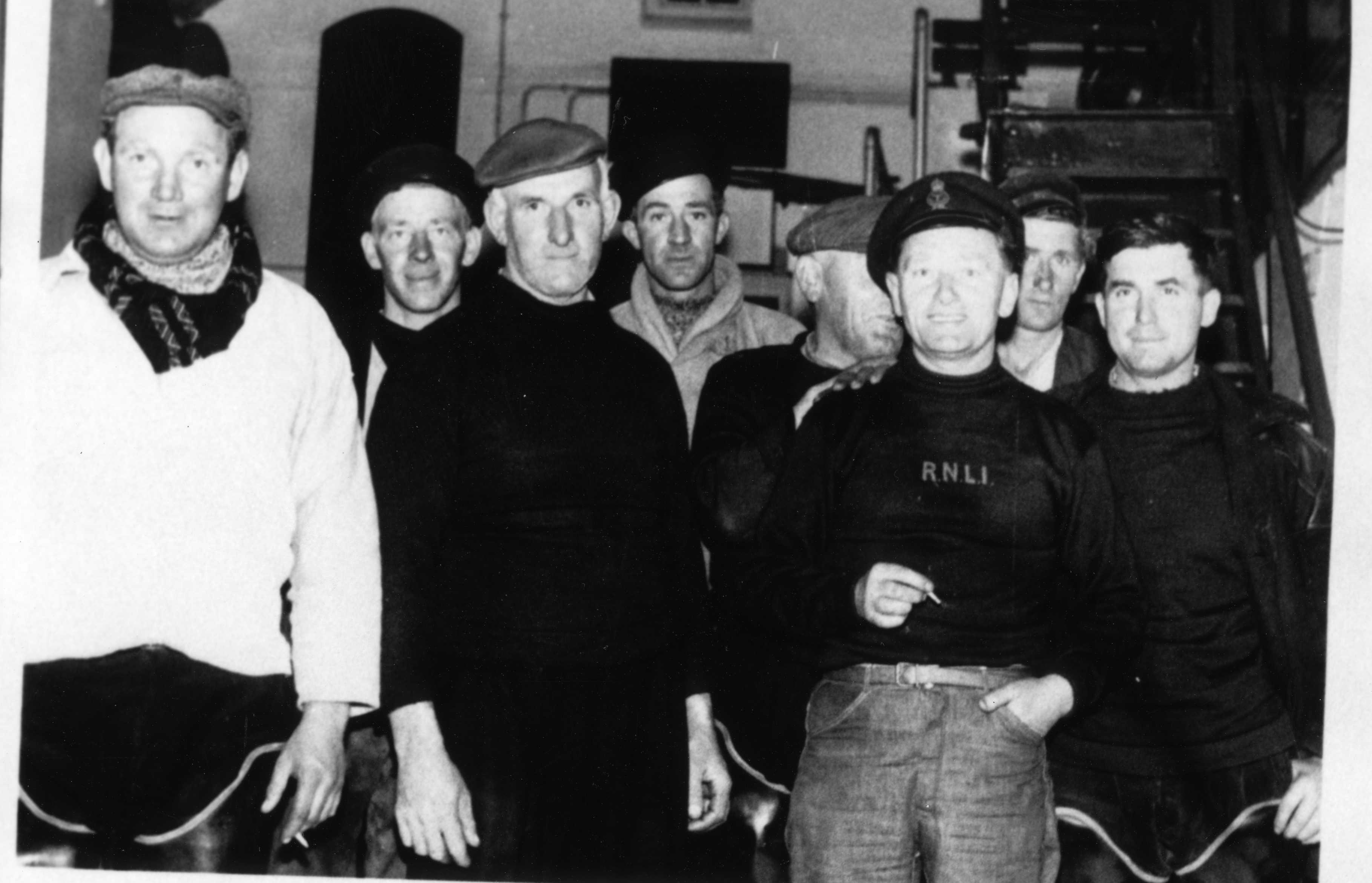 Lifeboat volunteers gather in the boathouse after a practice launch