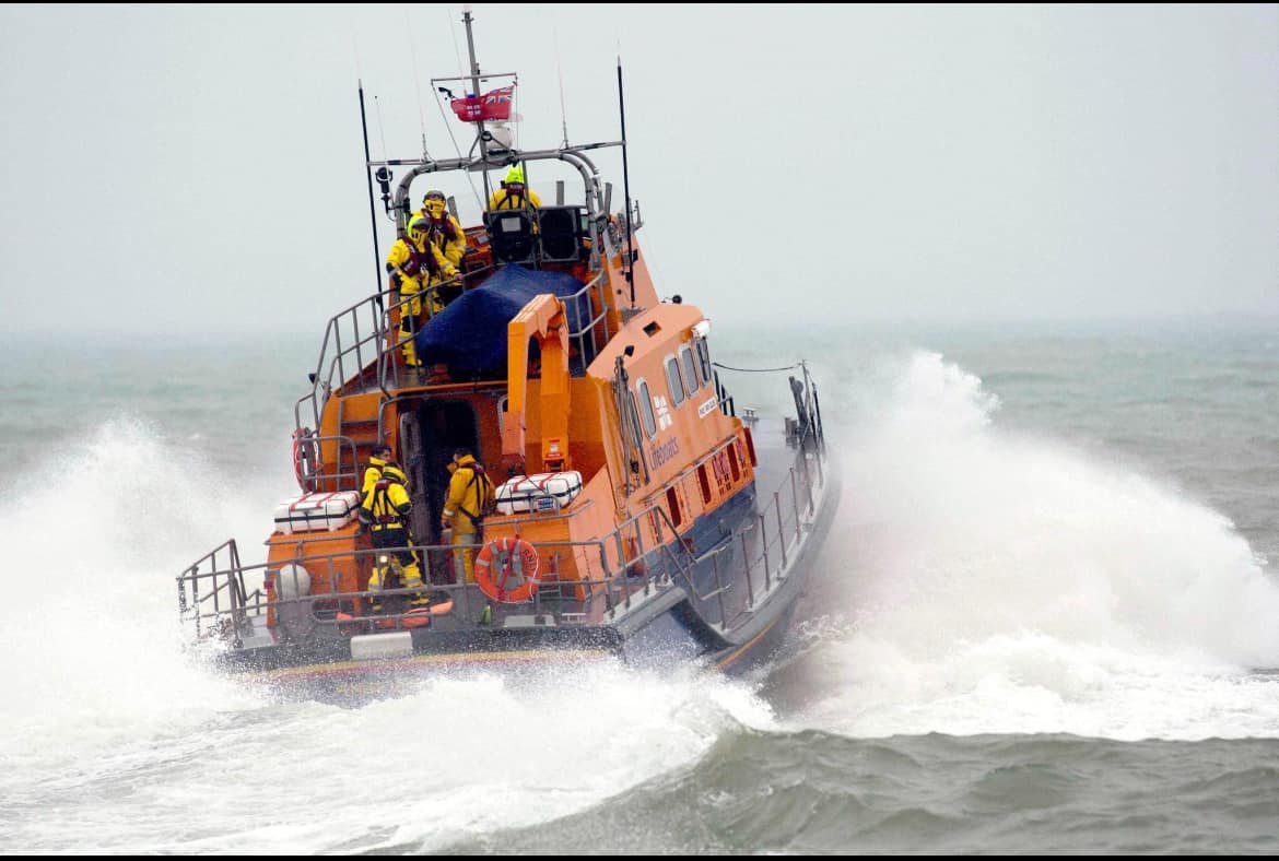 Shows a lifeboat in poor weather