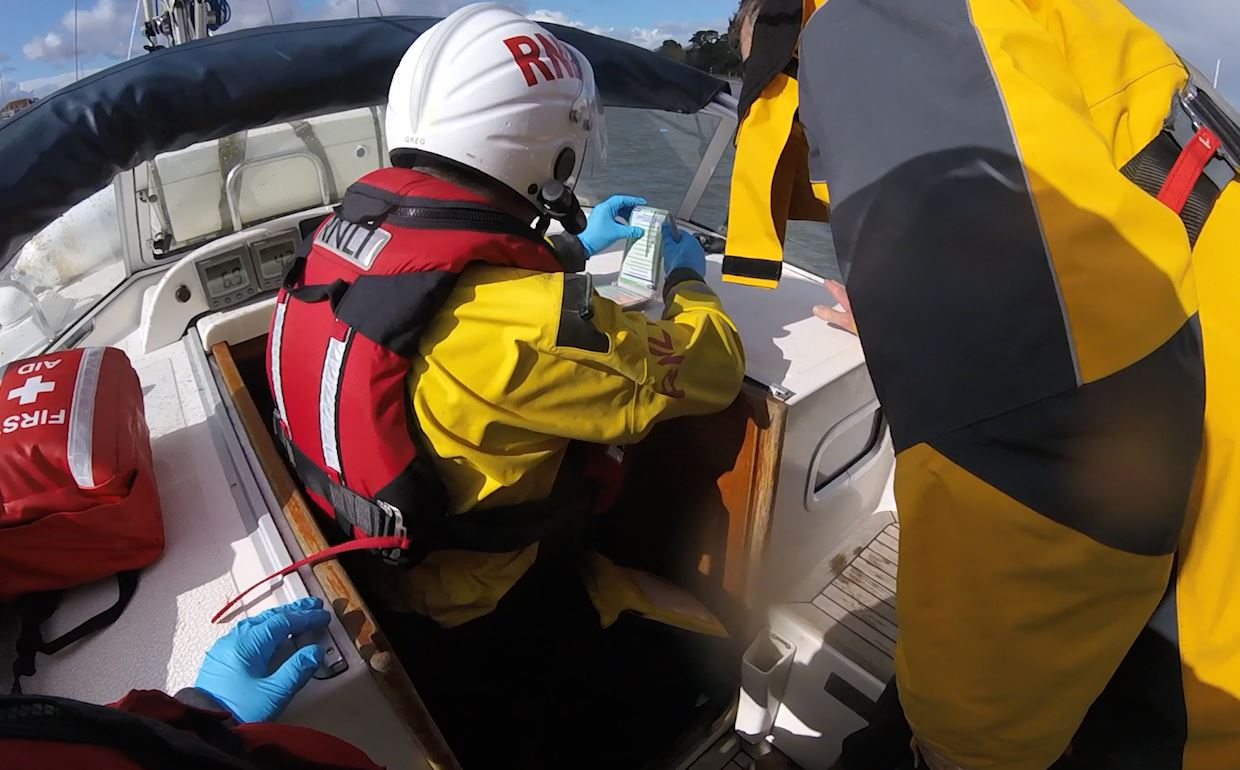 Lymington crewman monitoring casualty