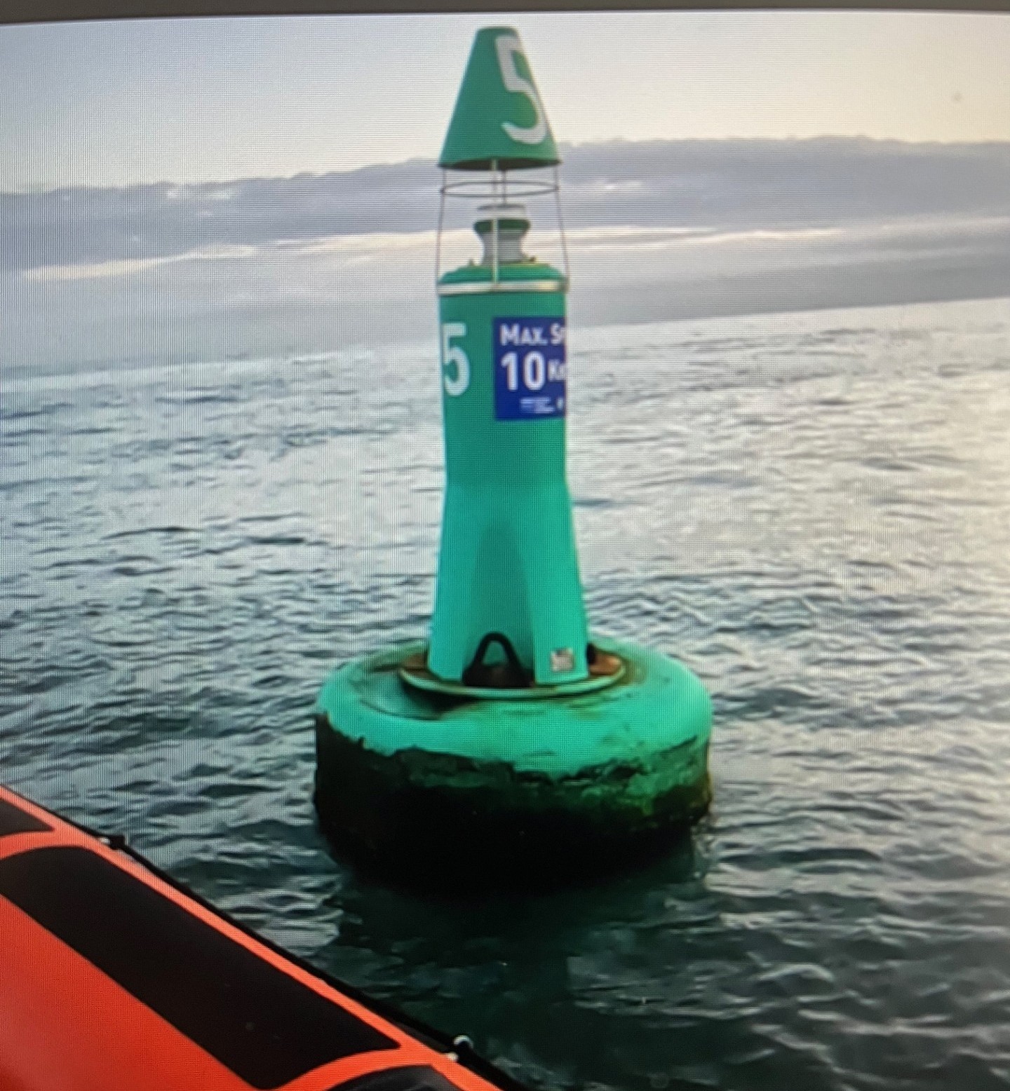 Photo shows green starboard navigation buoy found adrift off Charmouth