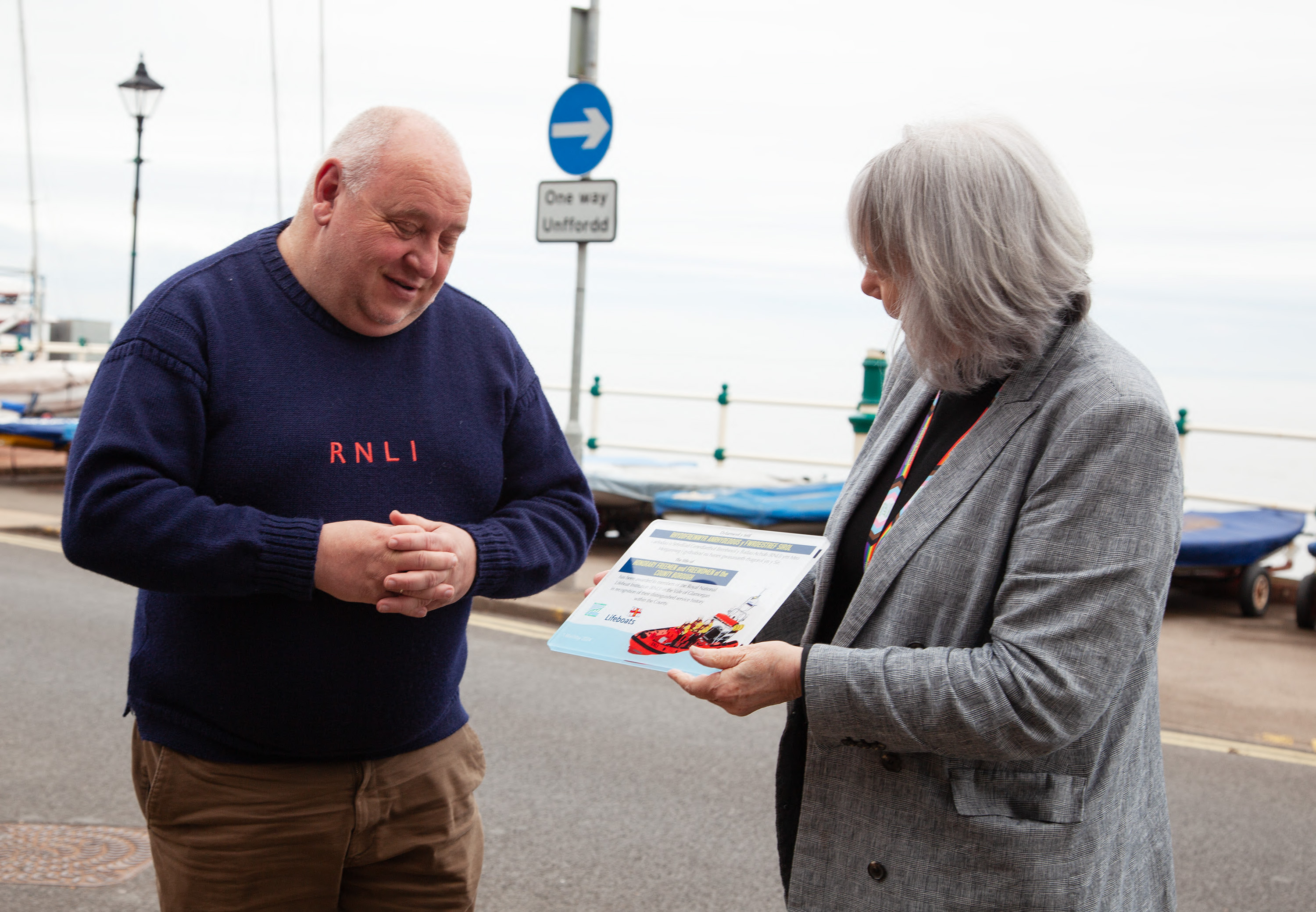 Jason Dunlop receiving plaque from Lis Burnett Leader of Vale Council