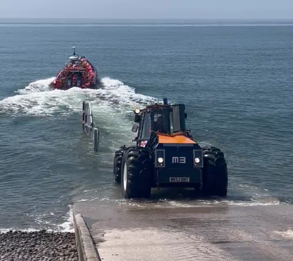 Lifeboat leaving the launching tractor at the bottom of the ramp