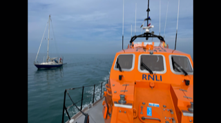 Porthdinllaen`s Tamar Class lifeboat escorting the yacht to Porthdinllaen Bay
