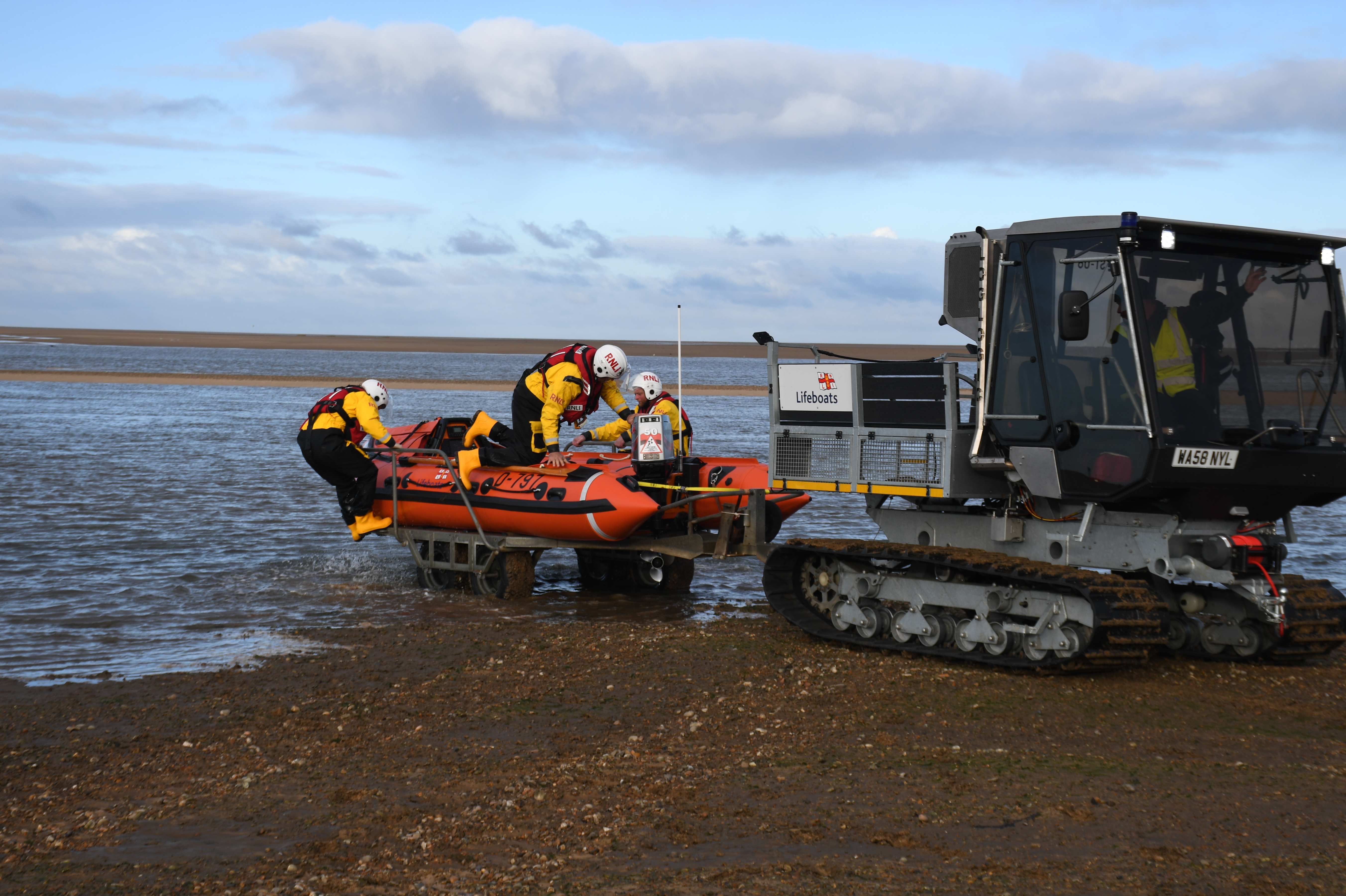 D-Class lifeboat launches into the sea, with the help of the tractor unit