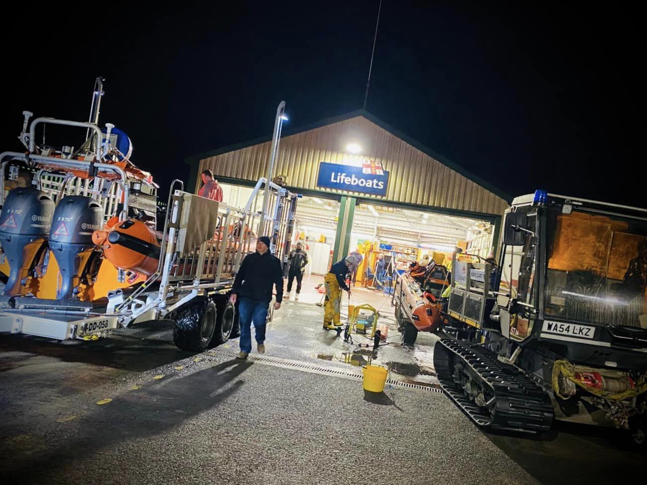 A library image of Burnham's liboats being washed down after recovery from a nighttime launch