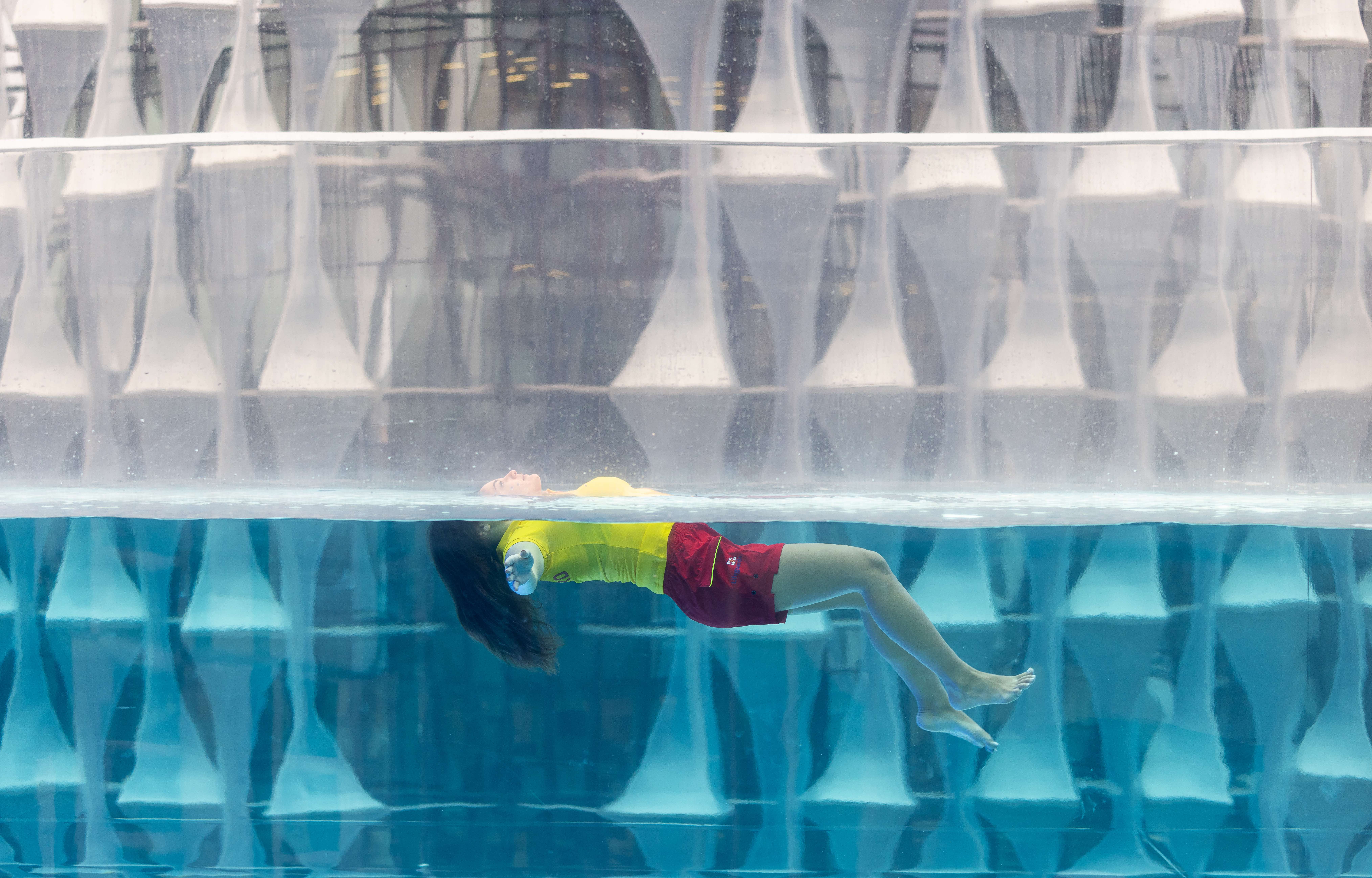 Lady in swimming pool in 'Float to Live' position