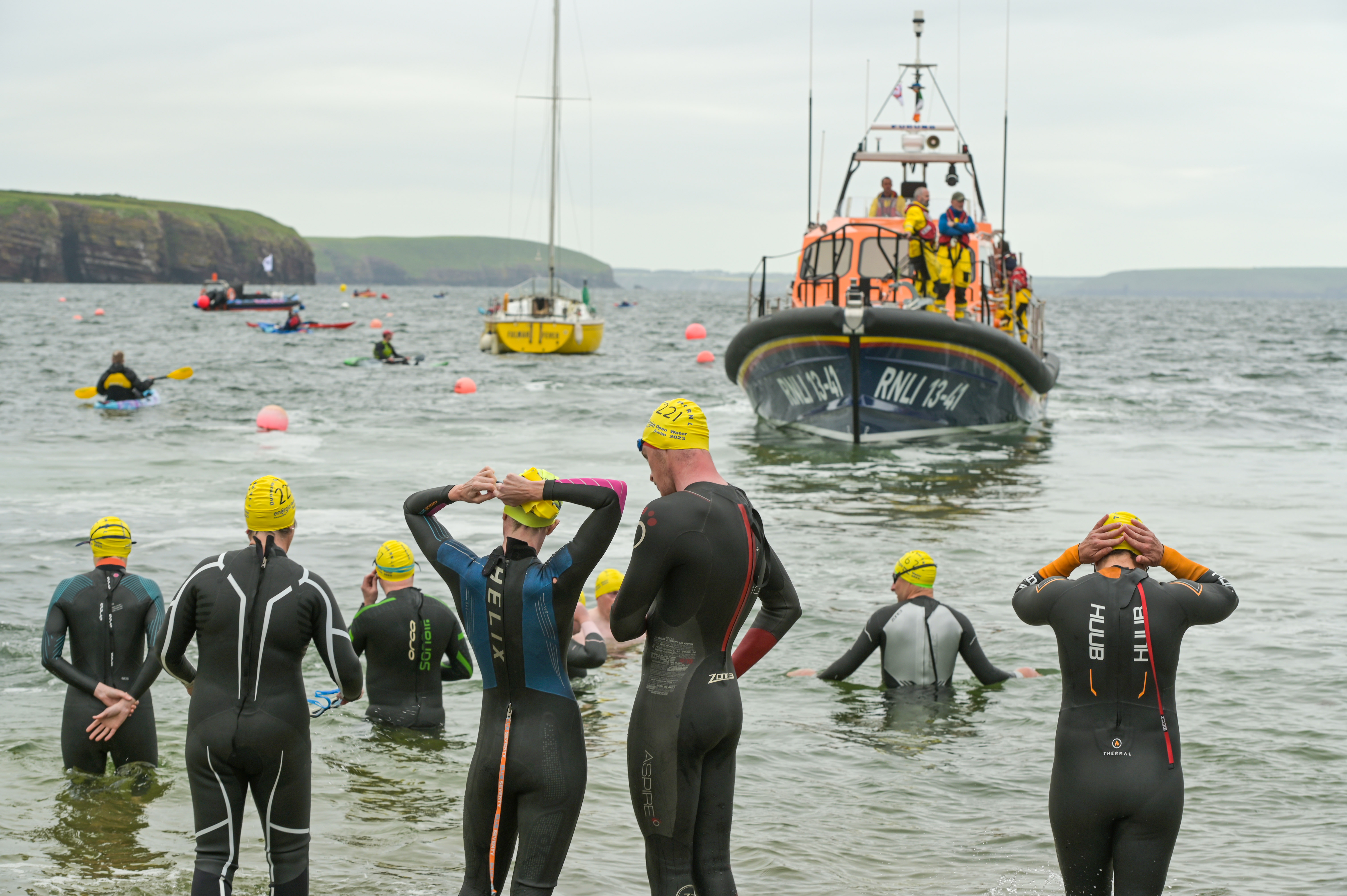 Swimmers prepare for action with Dunmore East RNLI All Weather Lifeboat in the background