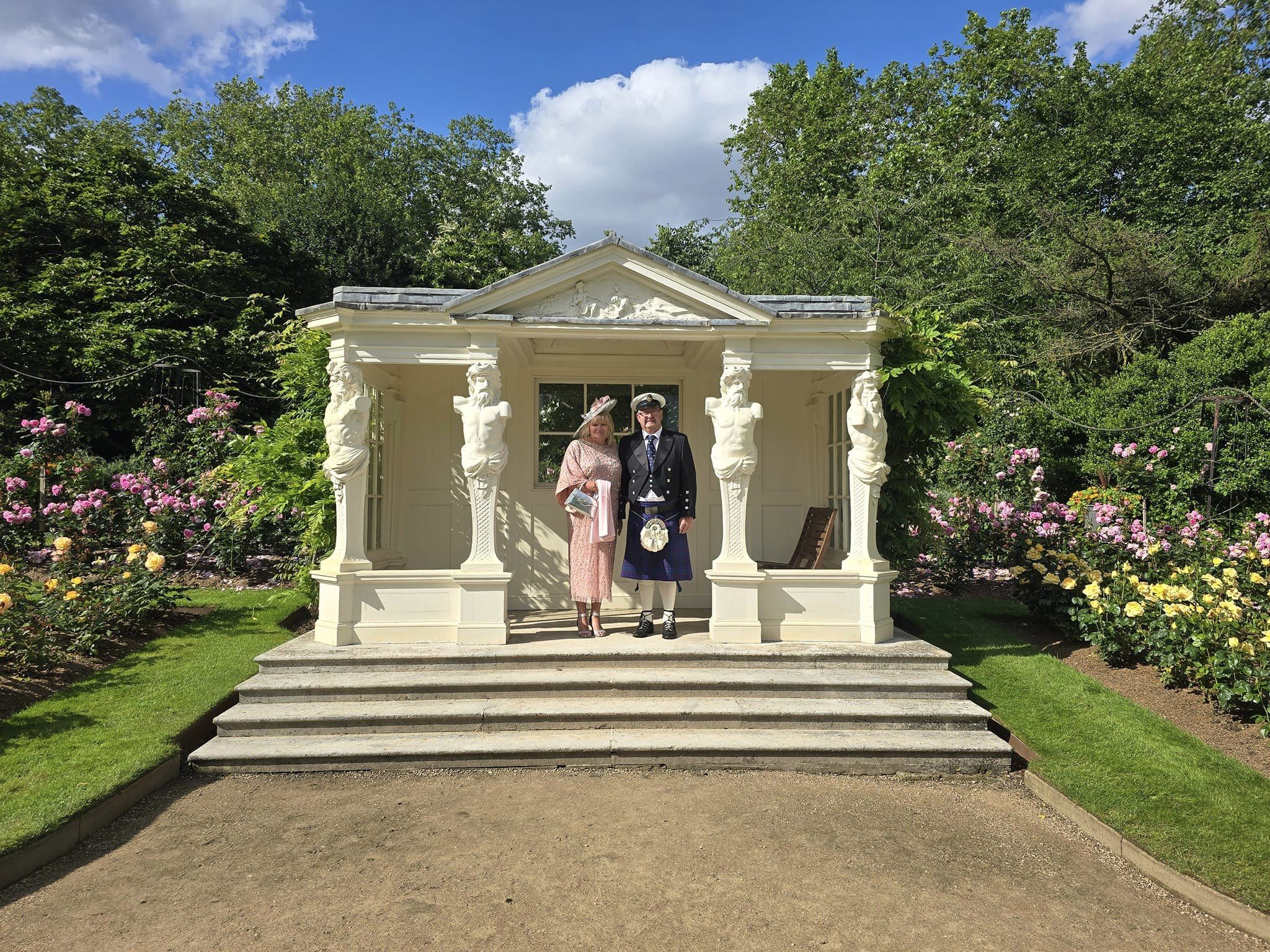 Christopher 'Jeeky' and Lillian Norris attend the RNLI 200th anniversary garden party at Buckingham Palace. They are pictured in the gardens.