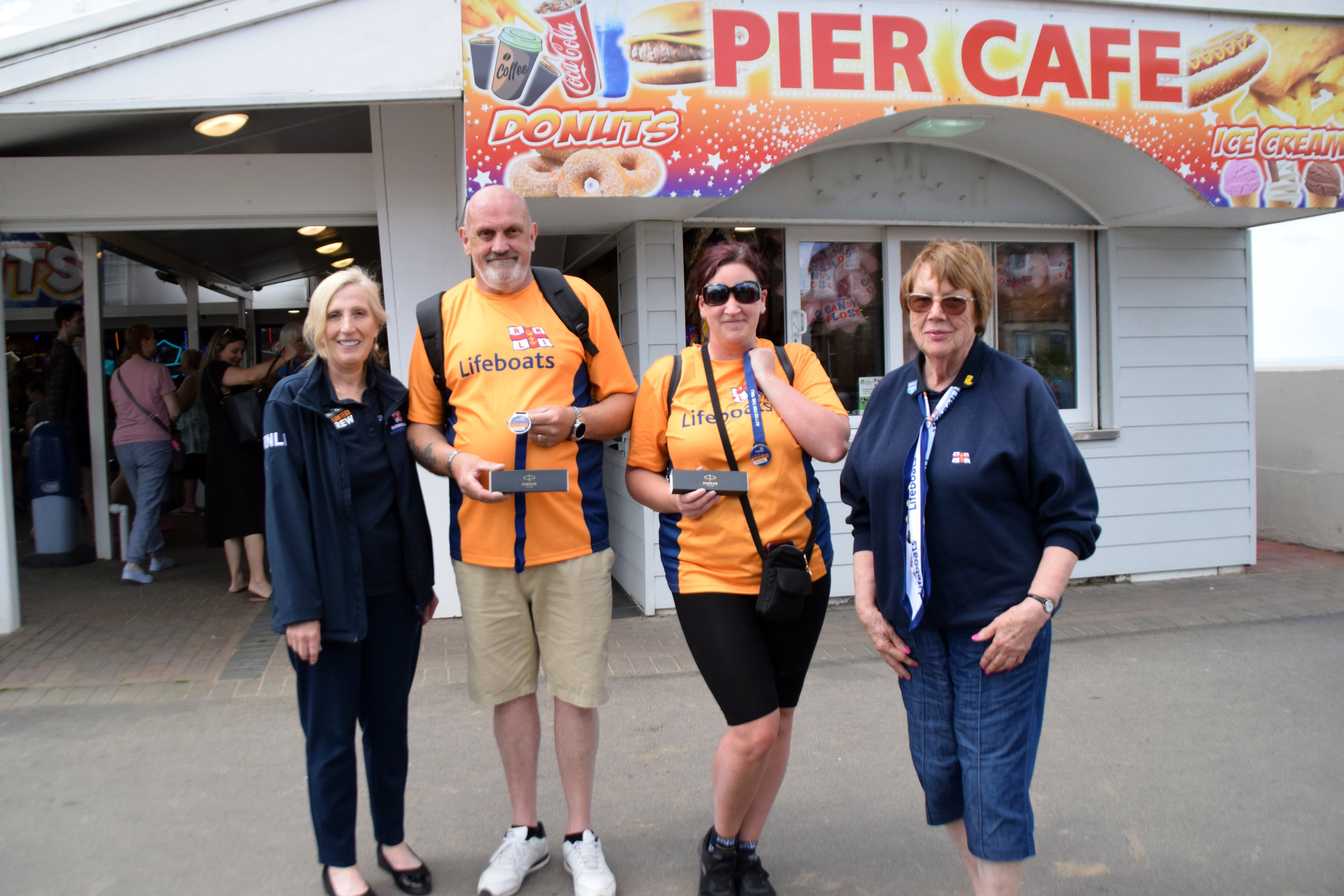 Fundraising Chair Denise Gocher, Royston Elmes, Lisa Smith, and Burnham Fundraising Treasurer Jan Pearce at Burnham Pavilion
