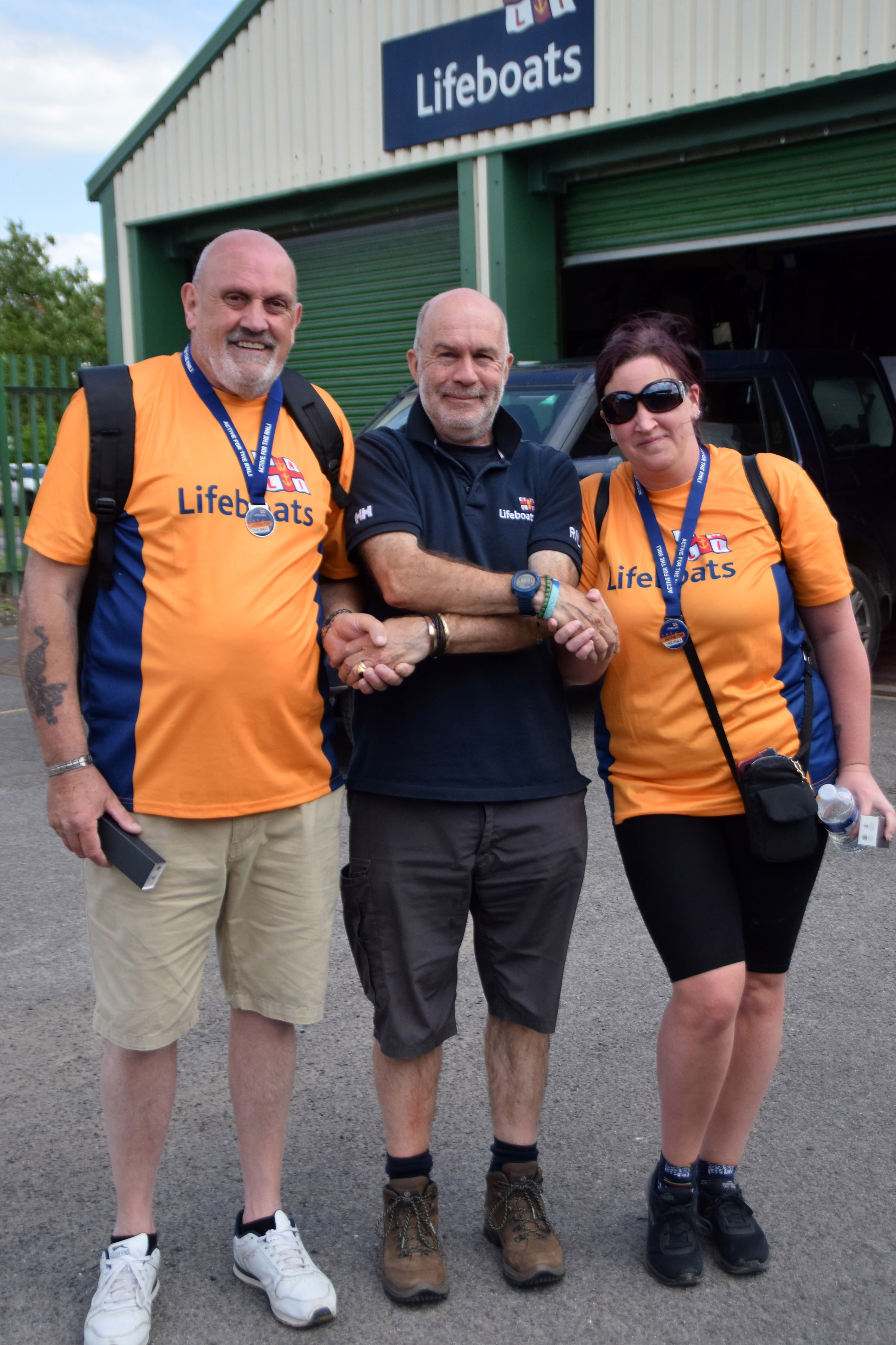 Royston Elmes, Duty Launch Authority Nigel Mortom, and Lisa Smith at Burnham RNLI lifeboat station
