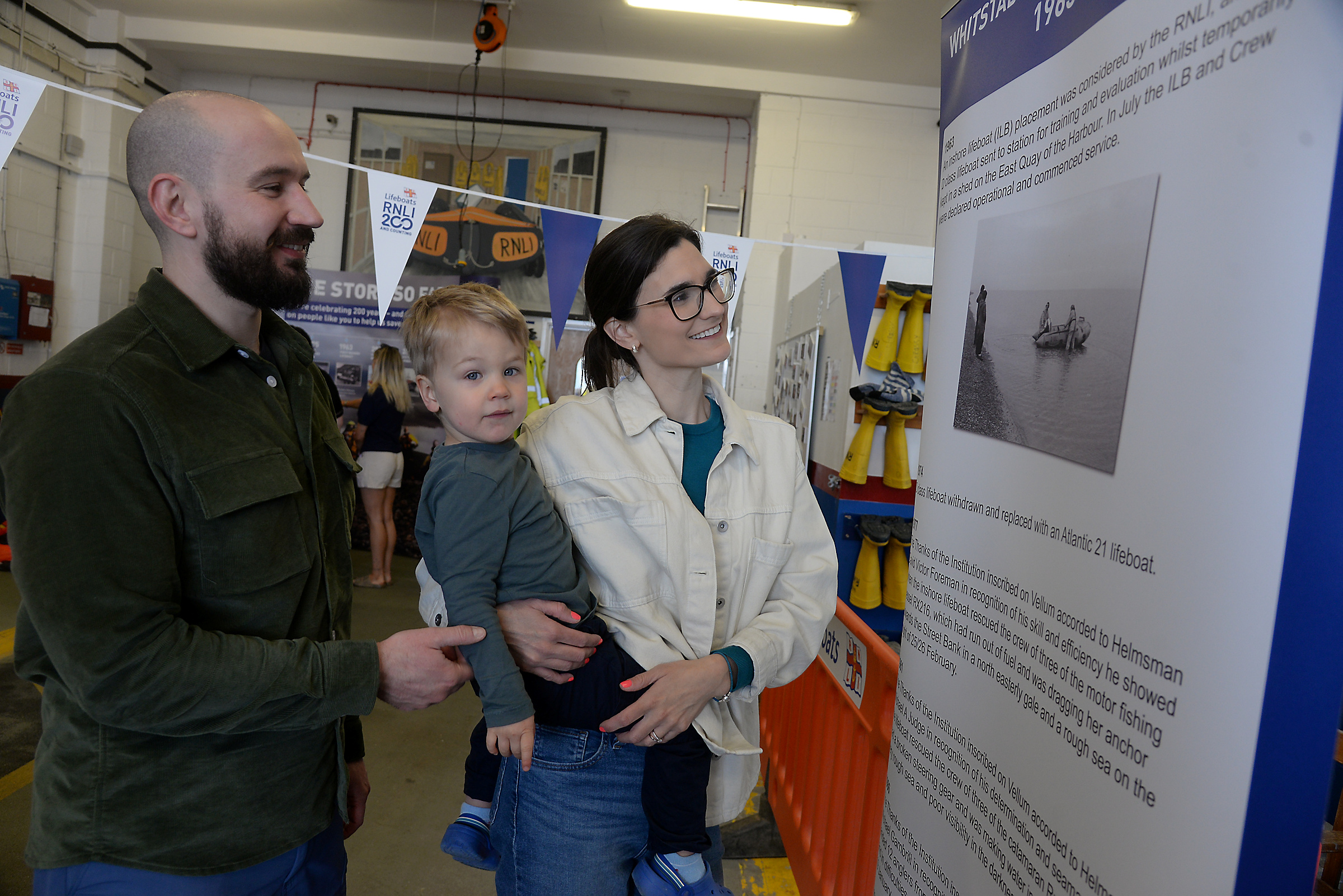 Ross, Cameron (two)and Marina Hardy from Hertfordshire take a look at one of the displays during the open day at Whitstable RNLI on bank holiday Monday.