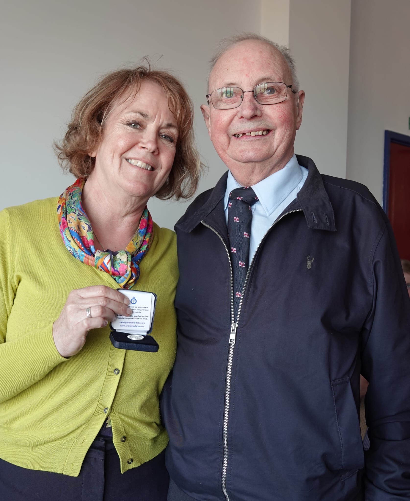 Jayne presenting Ken with an award for long service