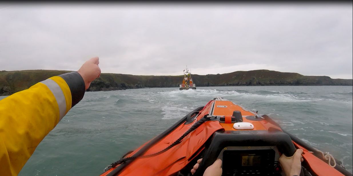 Fishguard lifeboats approaching the location of the beach on which the camp had been set up.

