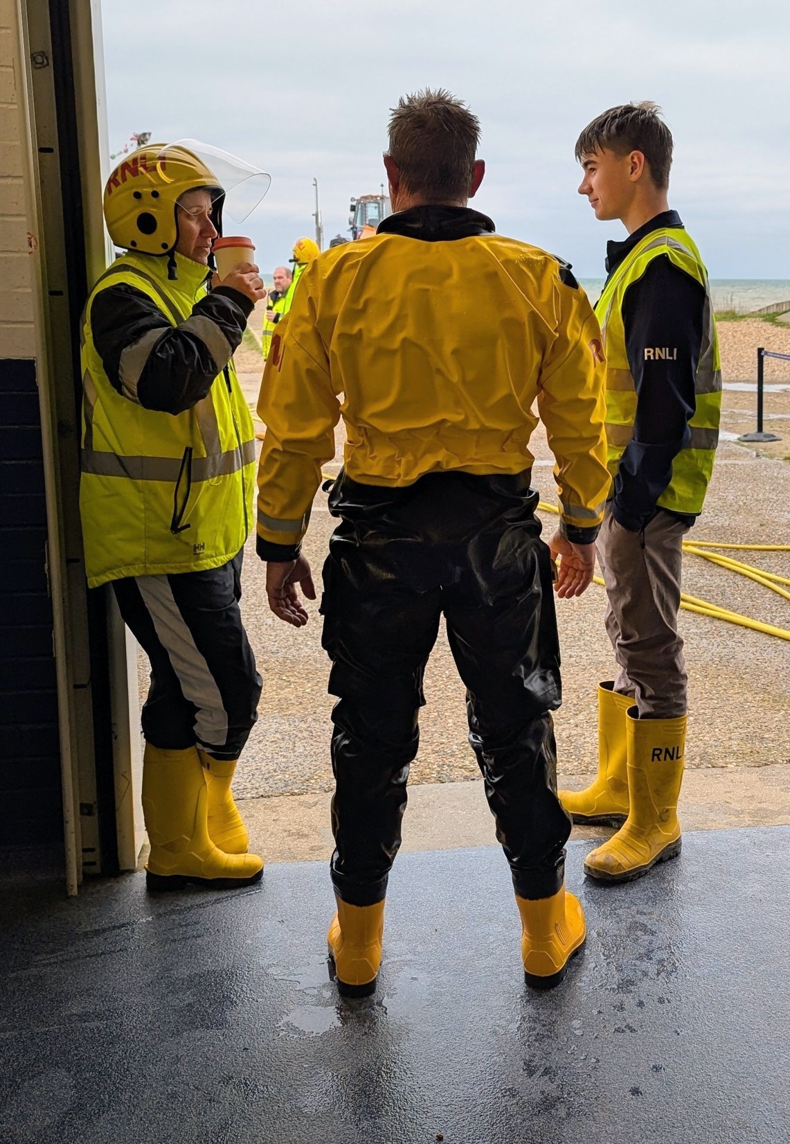 Three RNLI volunteers relaxing after a trip afloat 