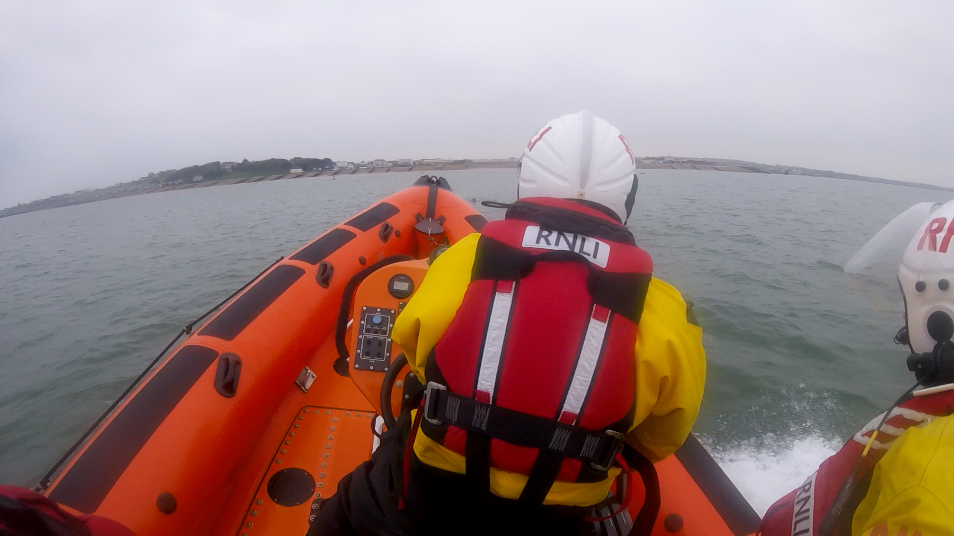 The crew of Whitstable Lifeboat locate the angler after he was swept off The Whitstable Street on Sunday morning.